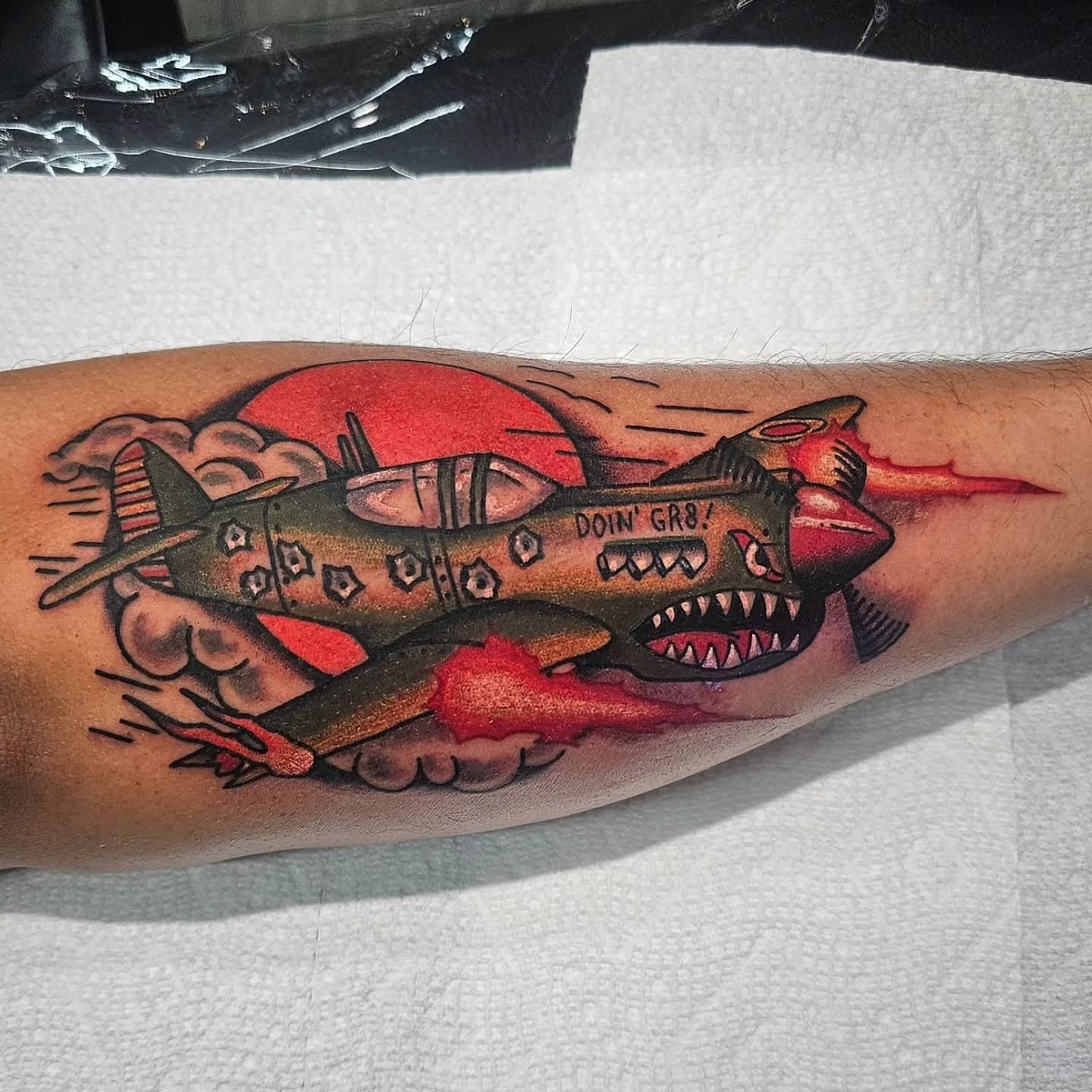 Warplane American traditional tattoo on the forearm by Oliver Ⴟ Graves