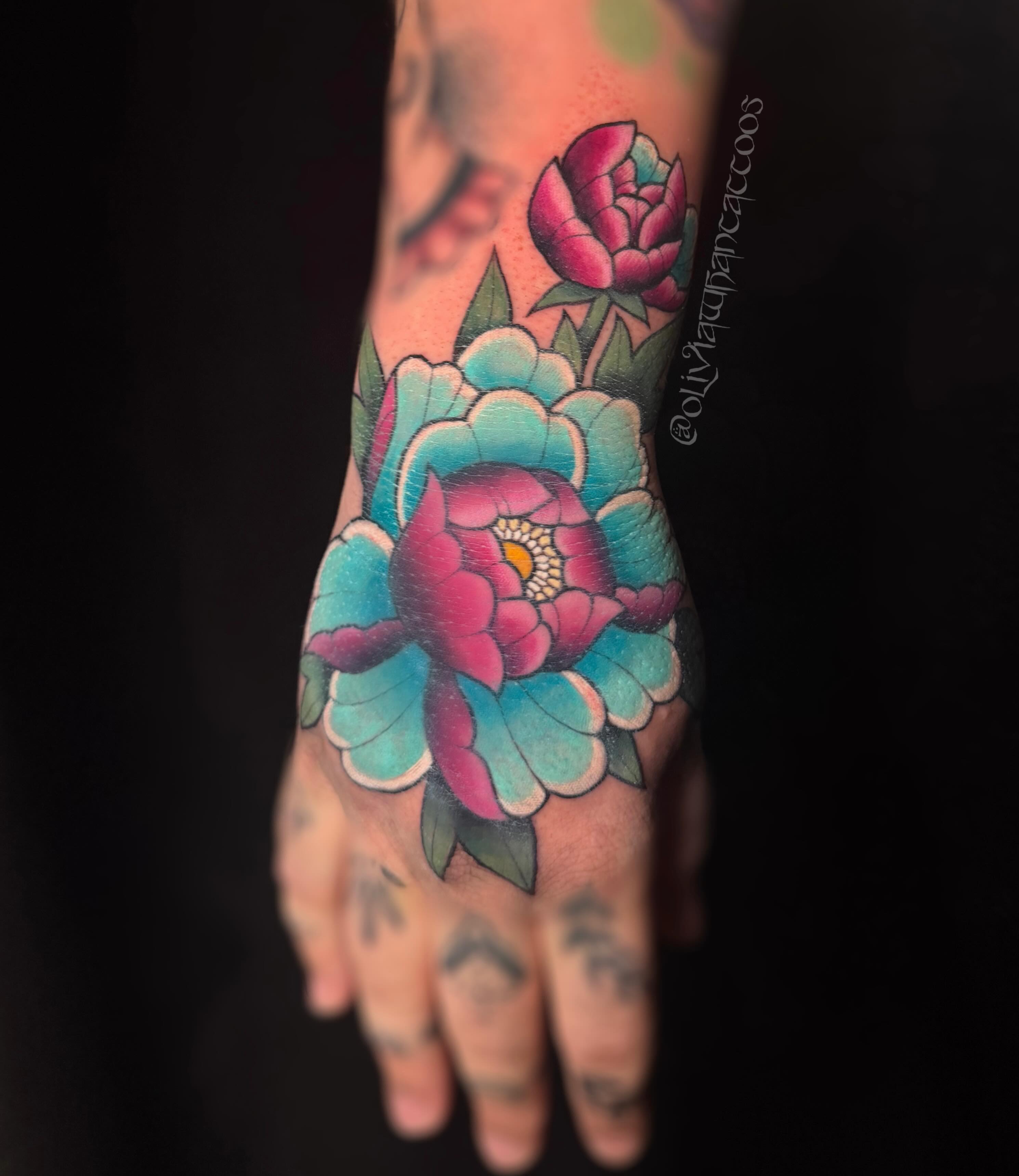 Peony American traditional tattoo on the hand by Olivia Whan Tattoos🌙