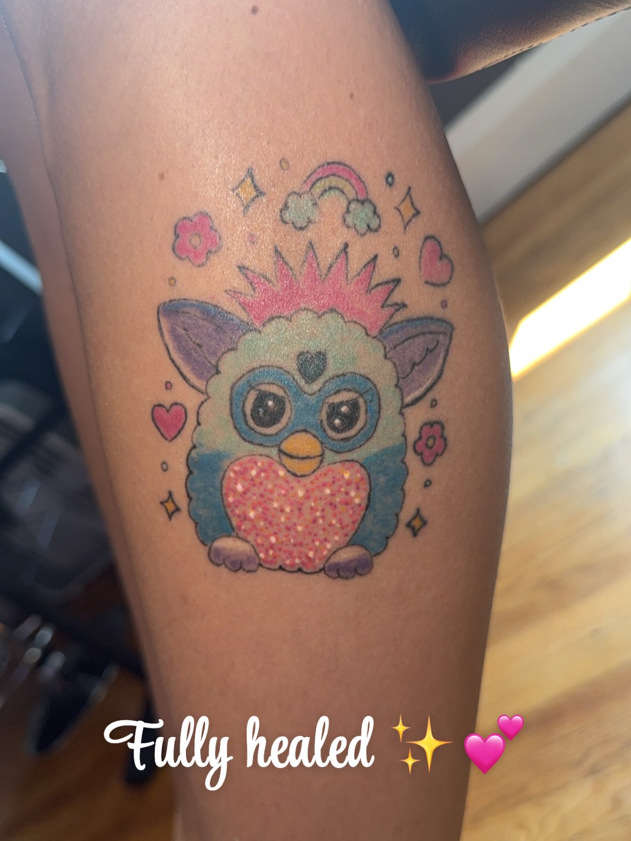 Cute animal with heart new school tattoo on the thigh by Felicia Lee, Des Moines, Iowa