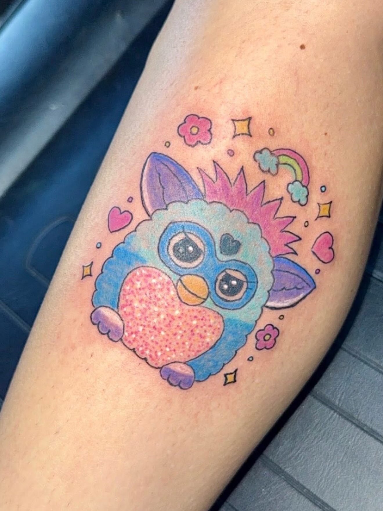 Owl with heart new school tattoo on the forearm by Felicia Lee, Des Moines, Iowa