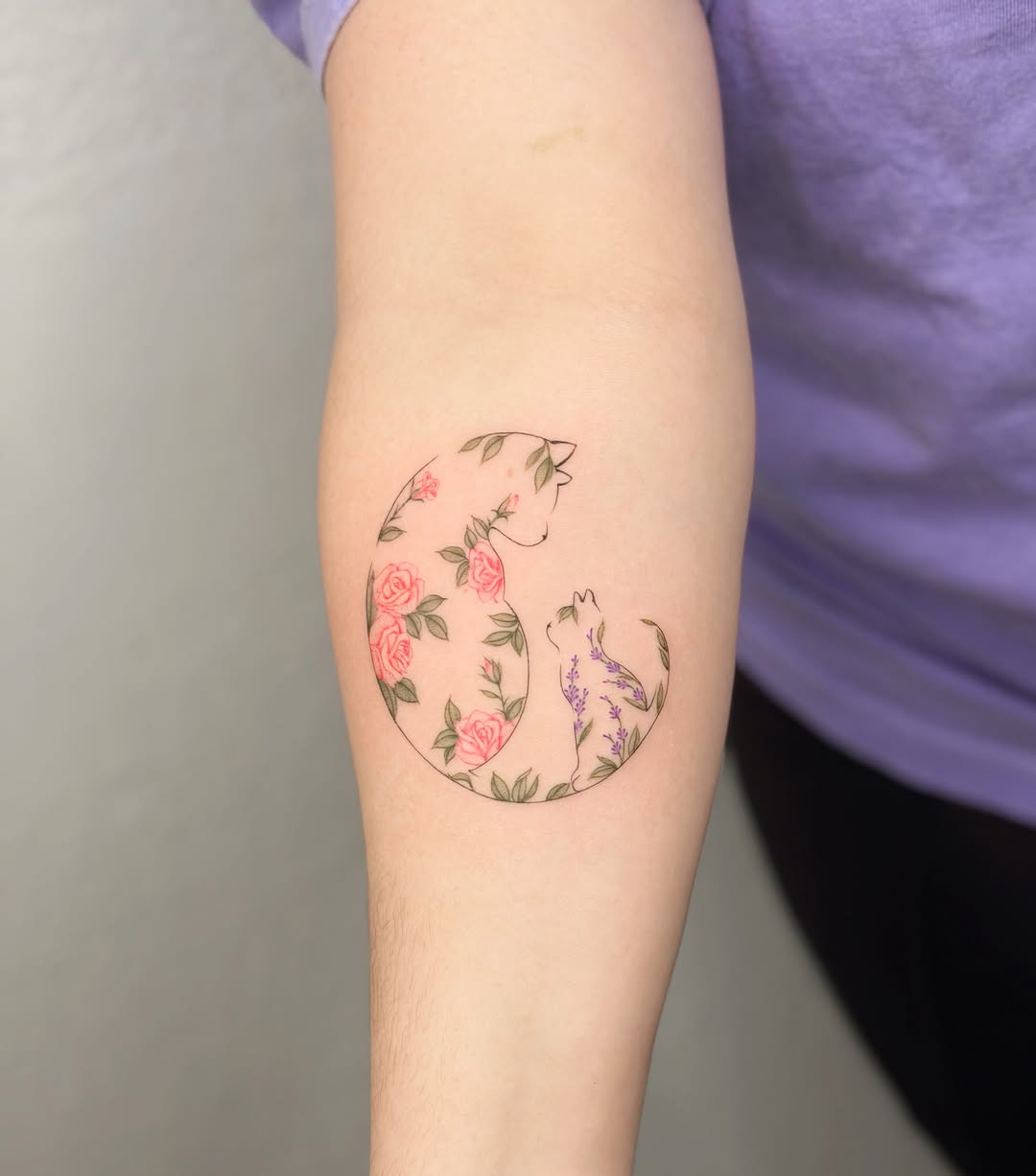 Two cats in floral circle fine line tattoo on the forearm by Seattle tattoo artist-Mia