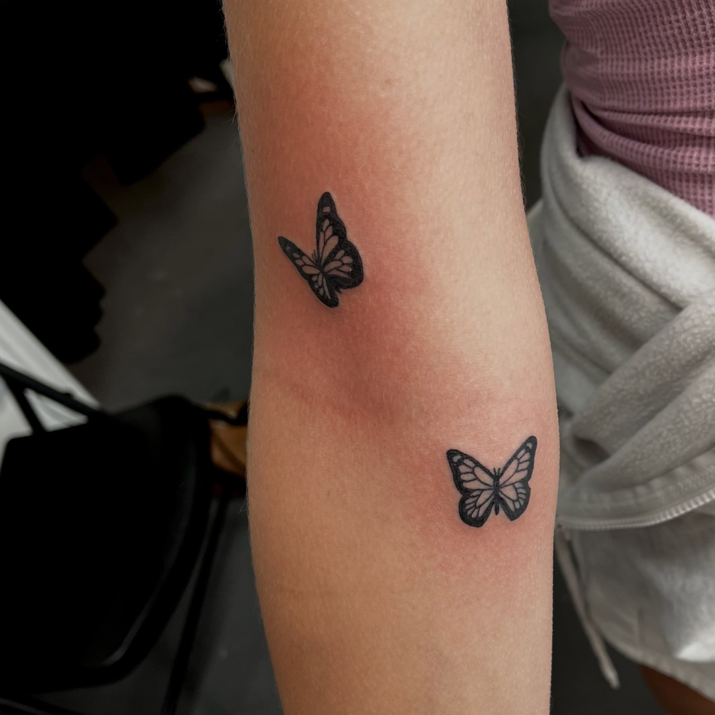 Butterfly black and grey tattoo on the forearm by Mason McCubbin
