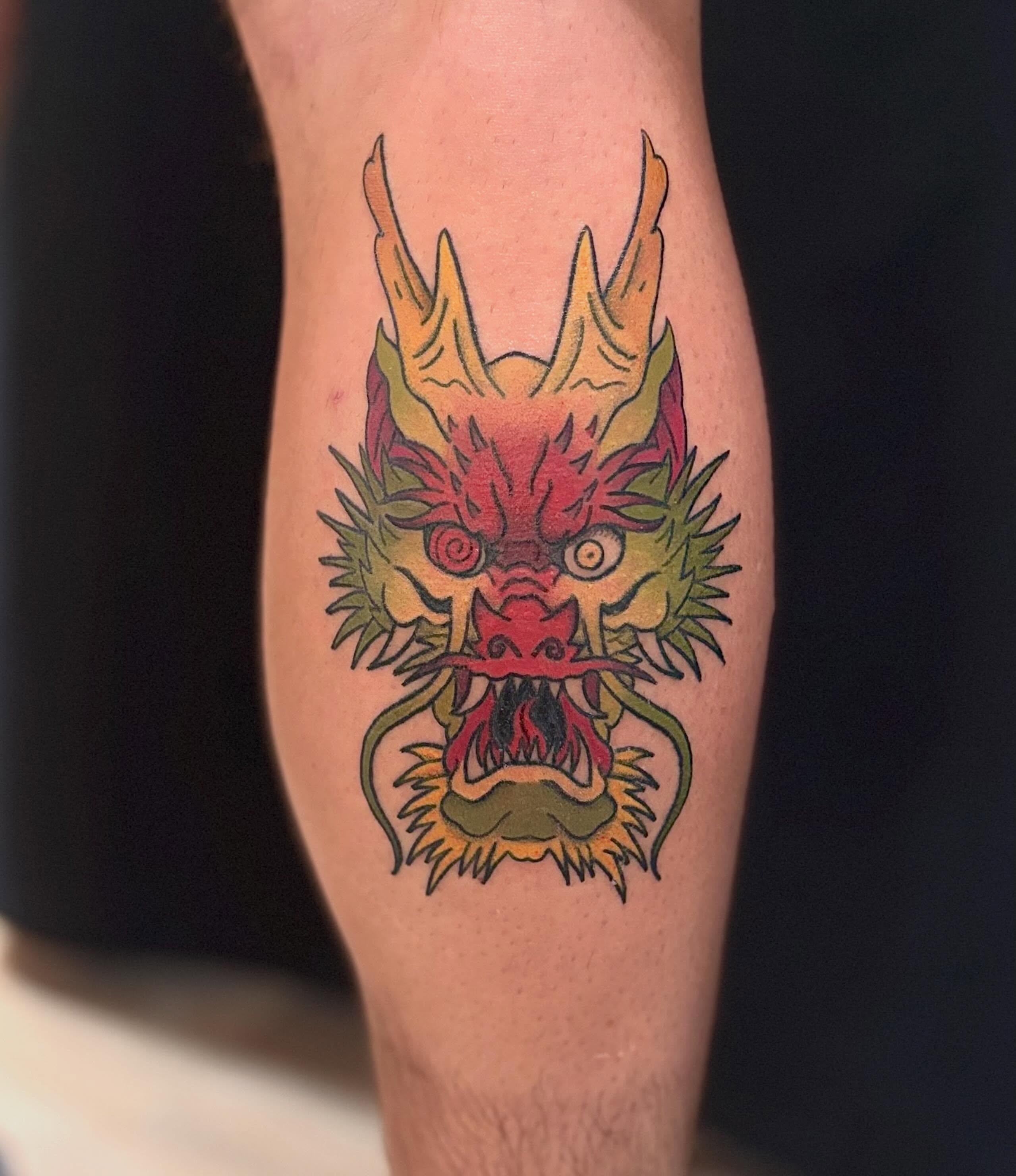 Dragon head American traditional tattoo on the forearm by Erica McCullough