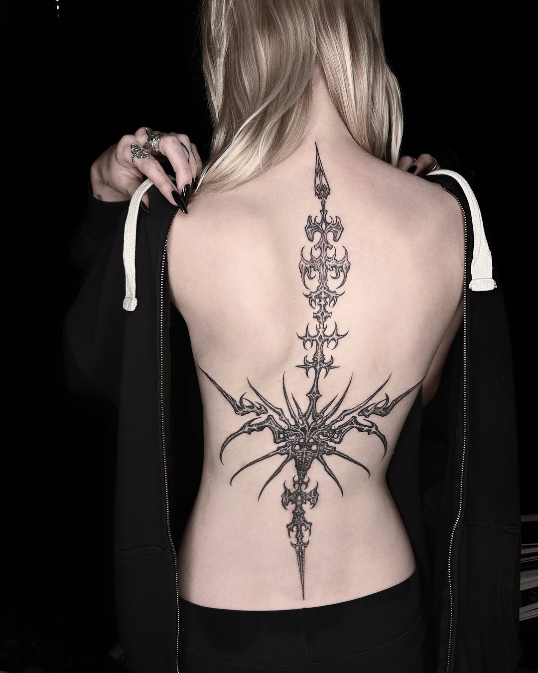 Ornamental spine piece cyber sigilism tattoo on the back by ๐๐ฆ๐ฐ๐ฆ๐