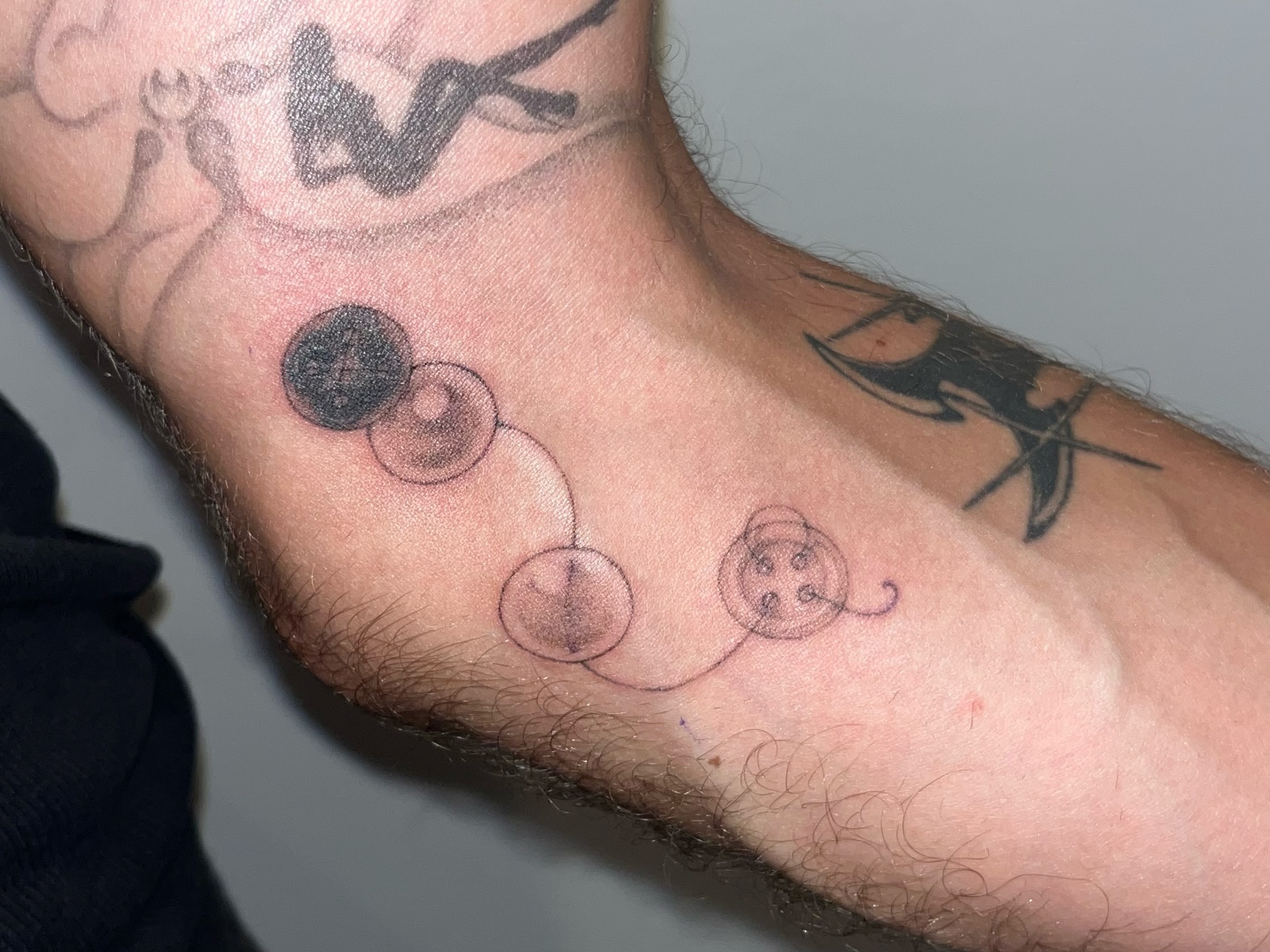 Planets dotwork tattoo on the forearm by 솝