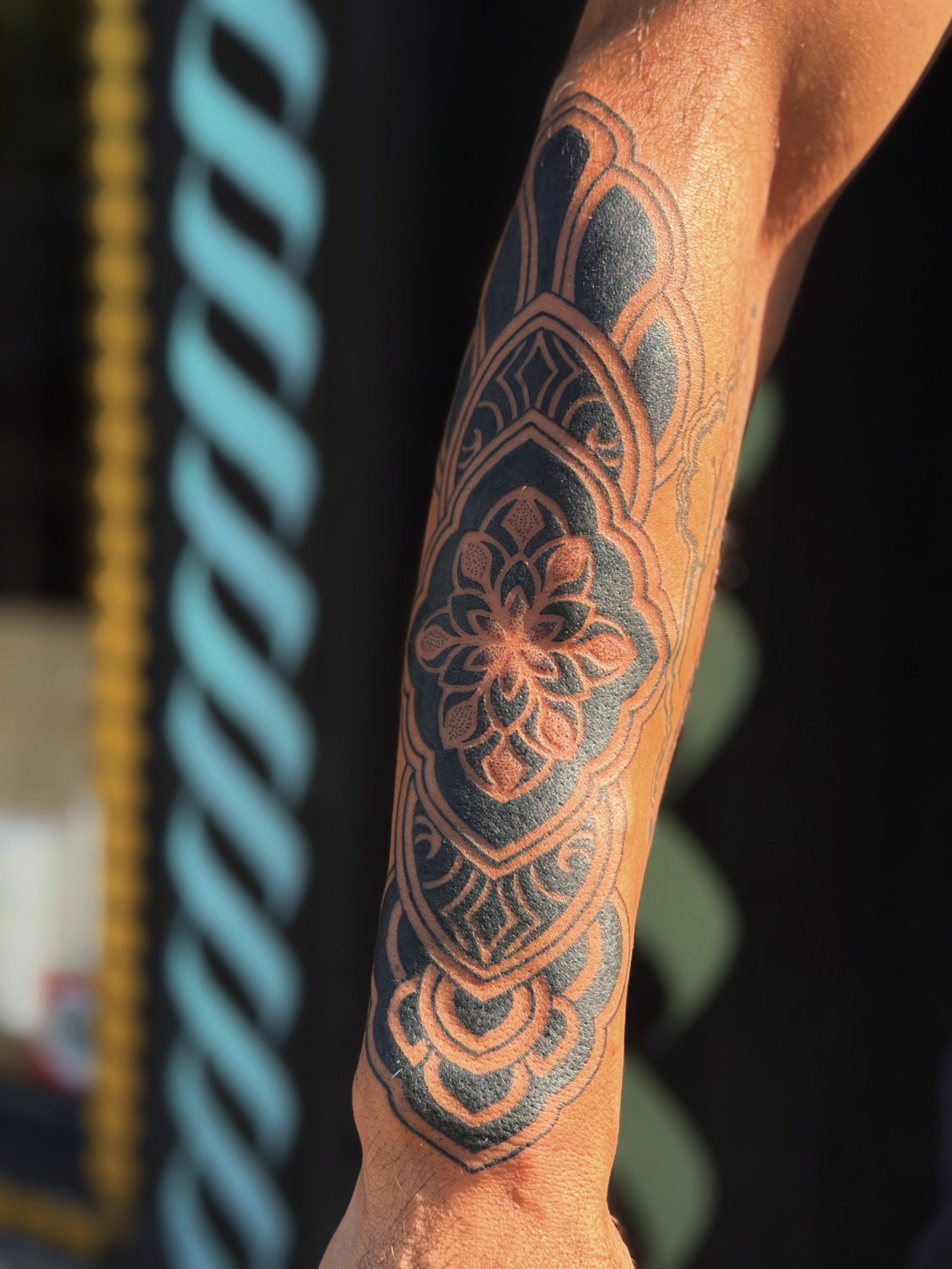 Mandala geometric tattoo on the forearm by Storm Smith