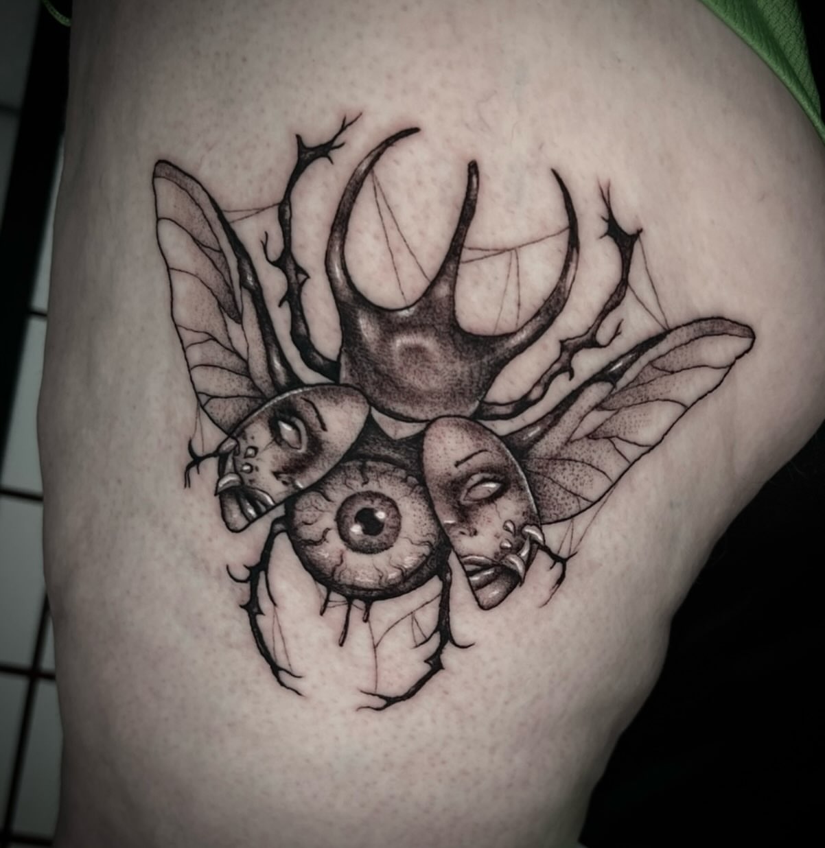Insect and faces realism tattoo on the thigh by π·ππ πππππ π·οΈ