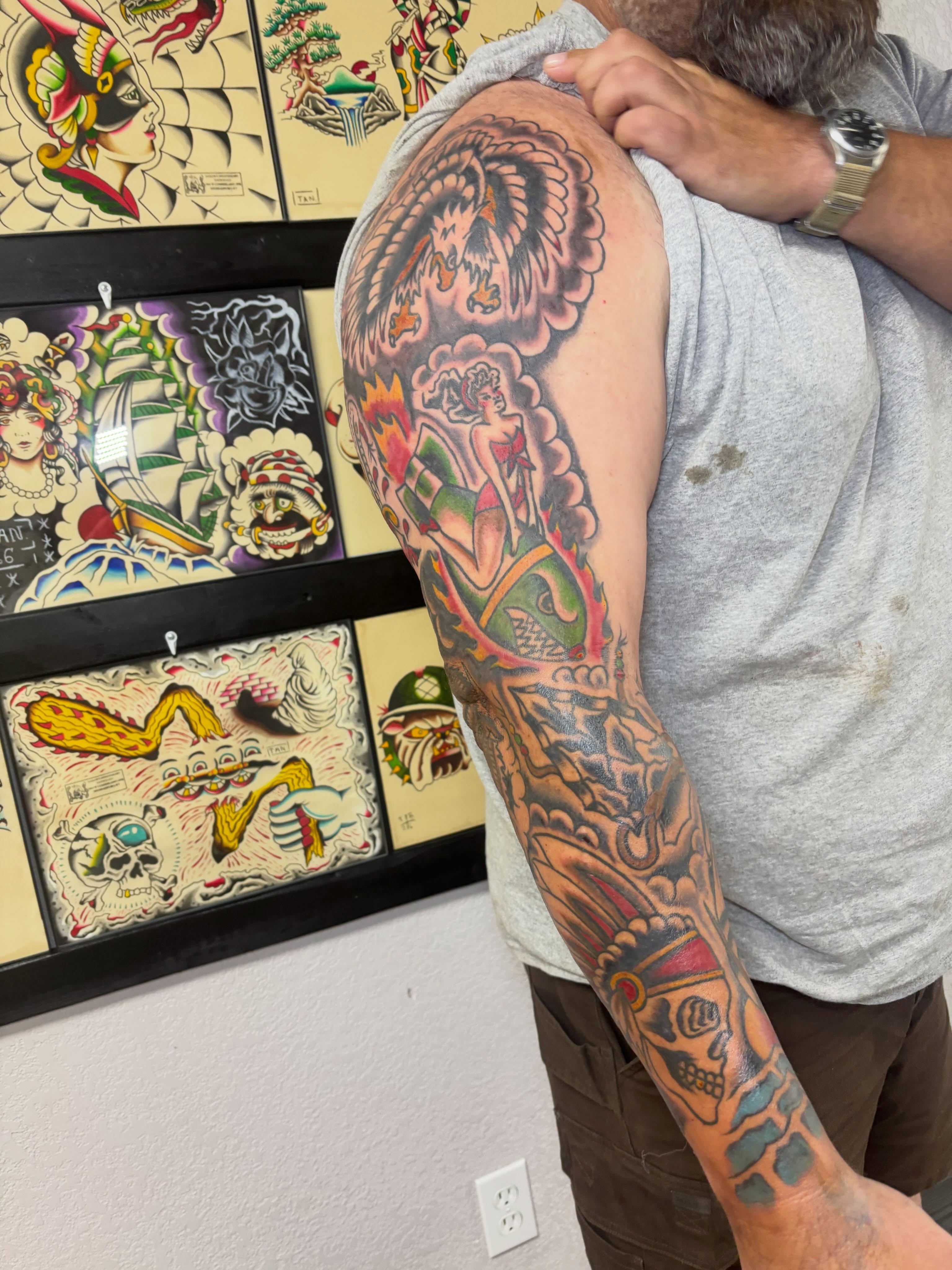 Woman with dragon American traditional tattoo on the upper arm by Bold Will Hold ๐ค