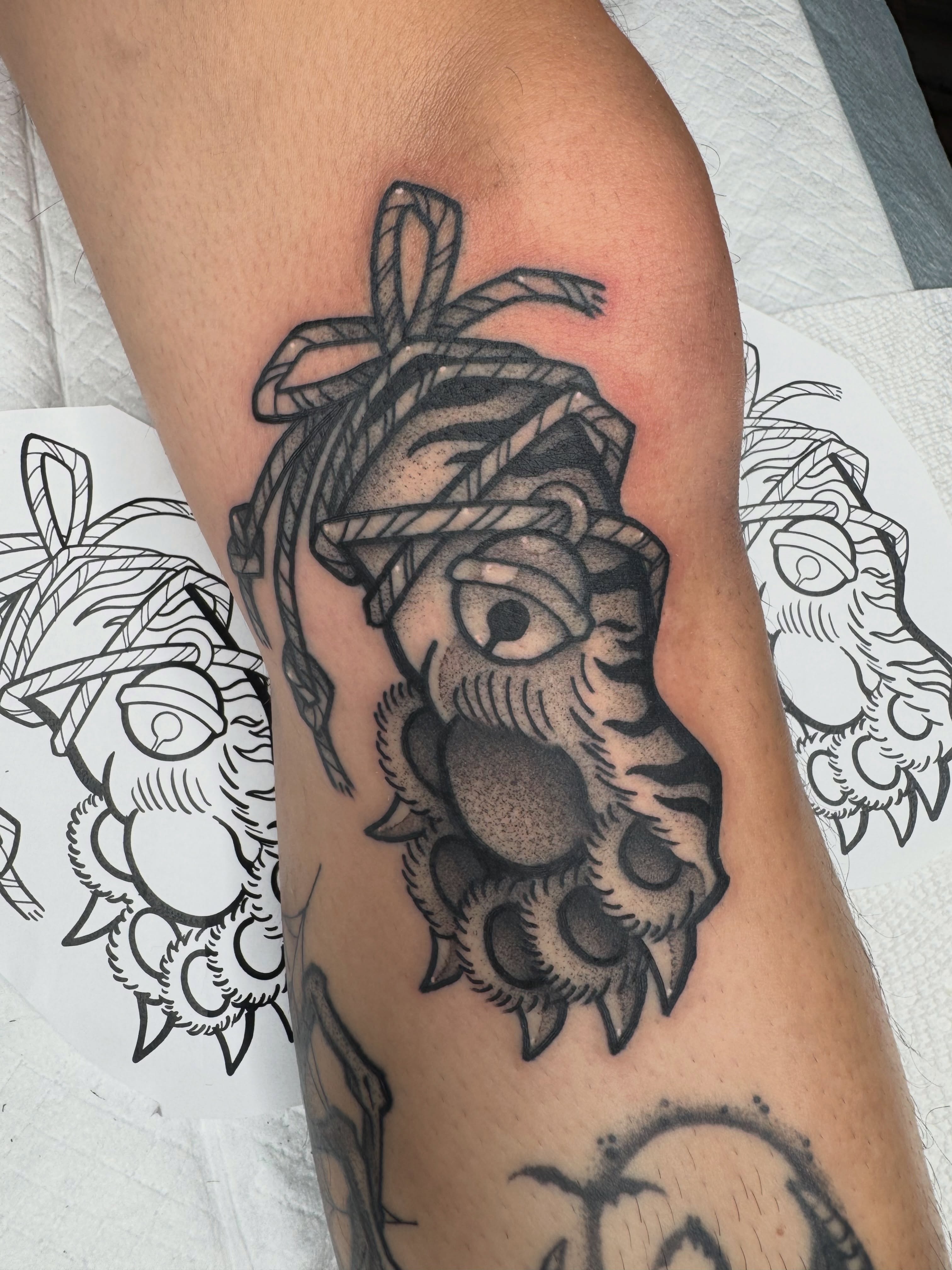 Lion head black and grey tattoo on the forearm by Donnie Moore