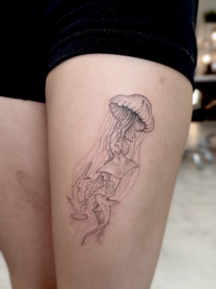 Jellyfish black and grey tattoo on the thigh by Anna