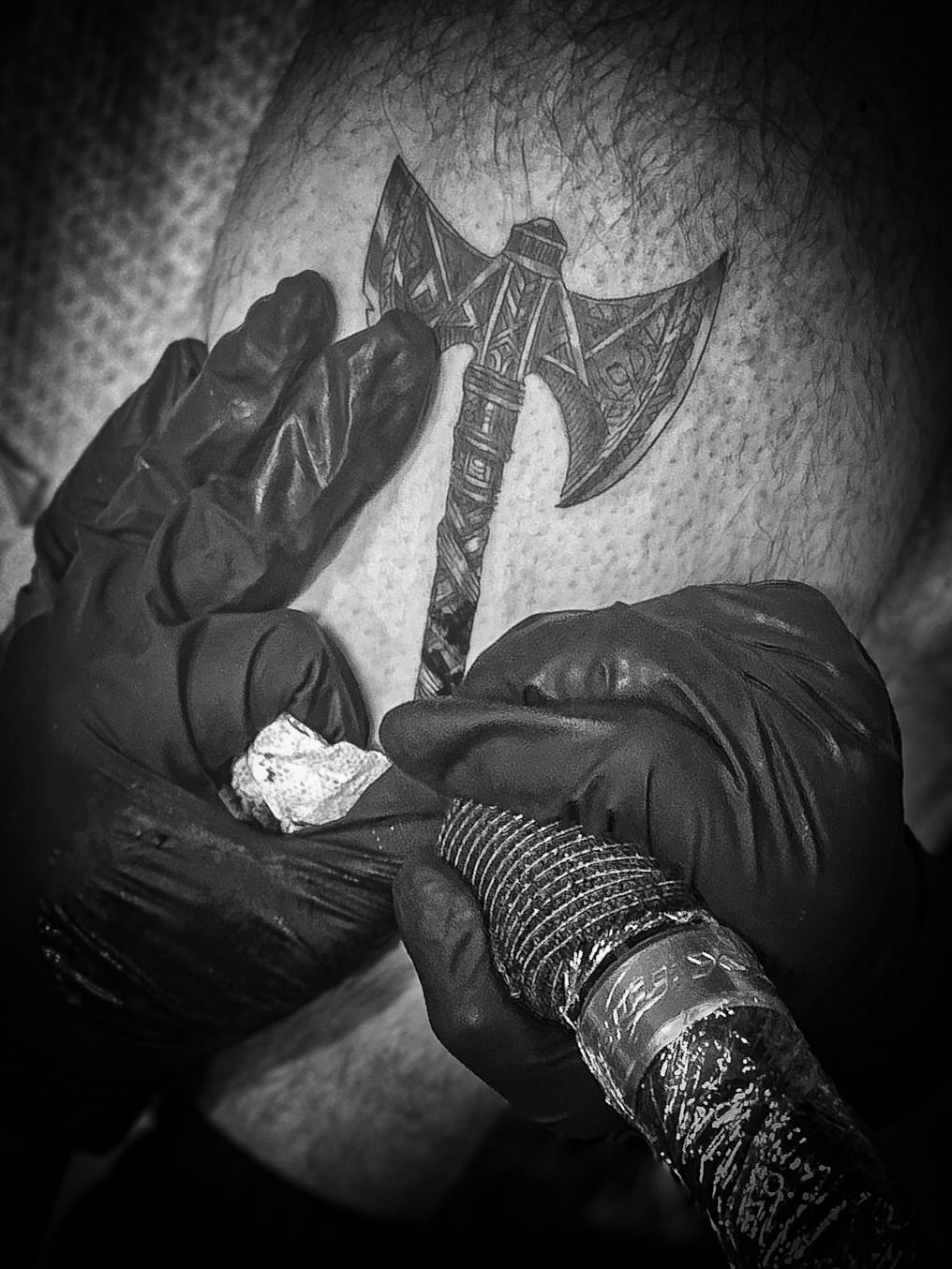 Ax black and grey tattoo on the forearm by Andres Flores