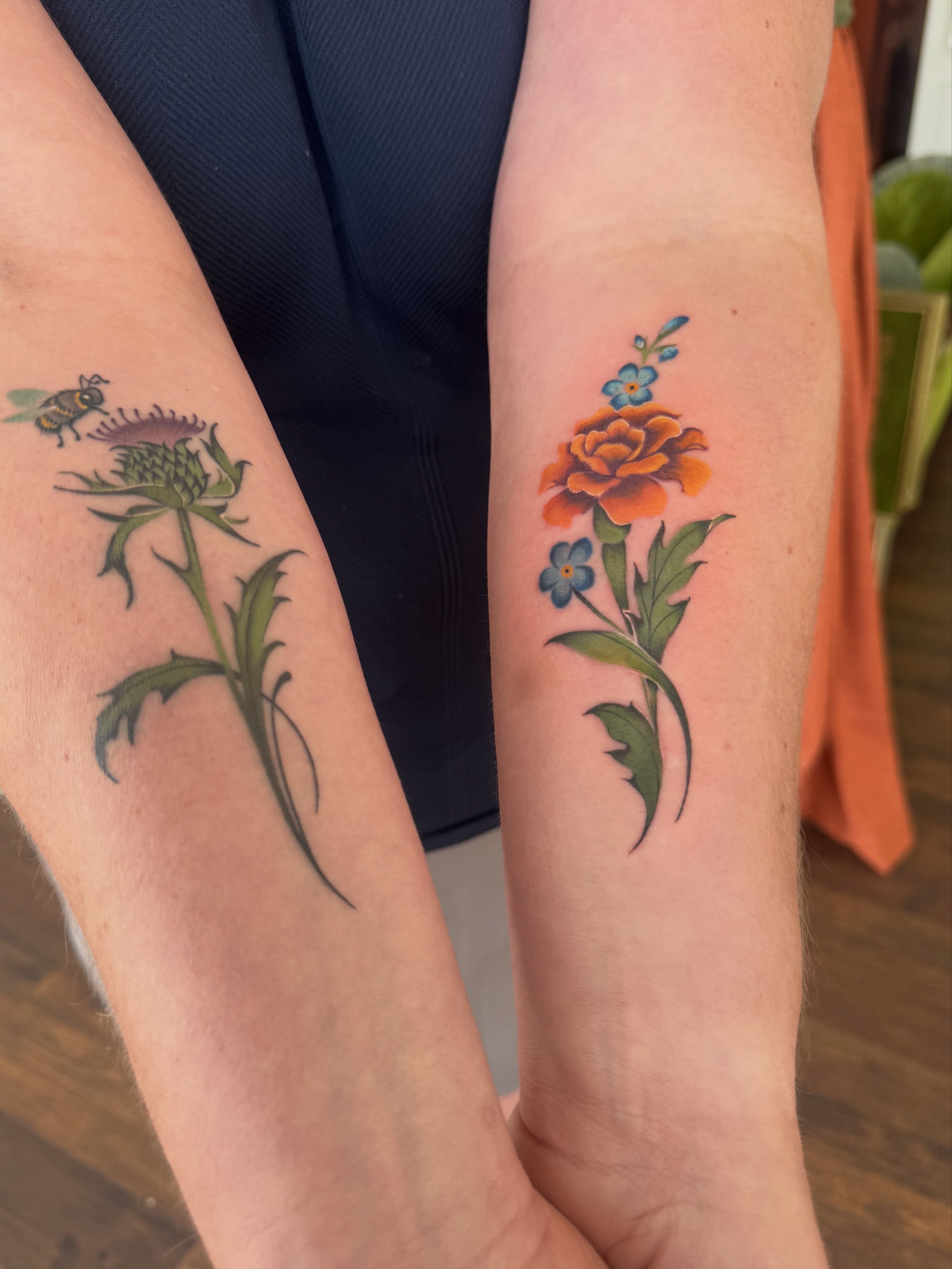 Flower and thistle realism tattoo on the forearm by Alisa (Li) Affatato ๐ผ