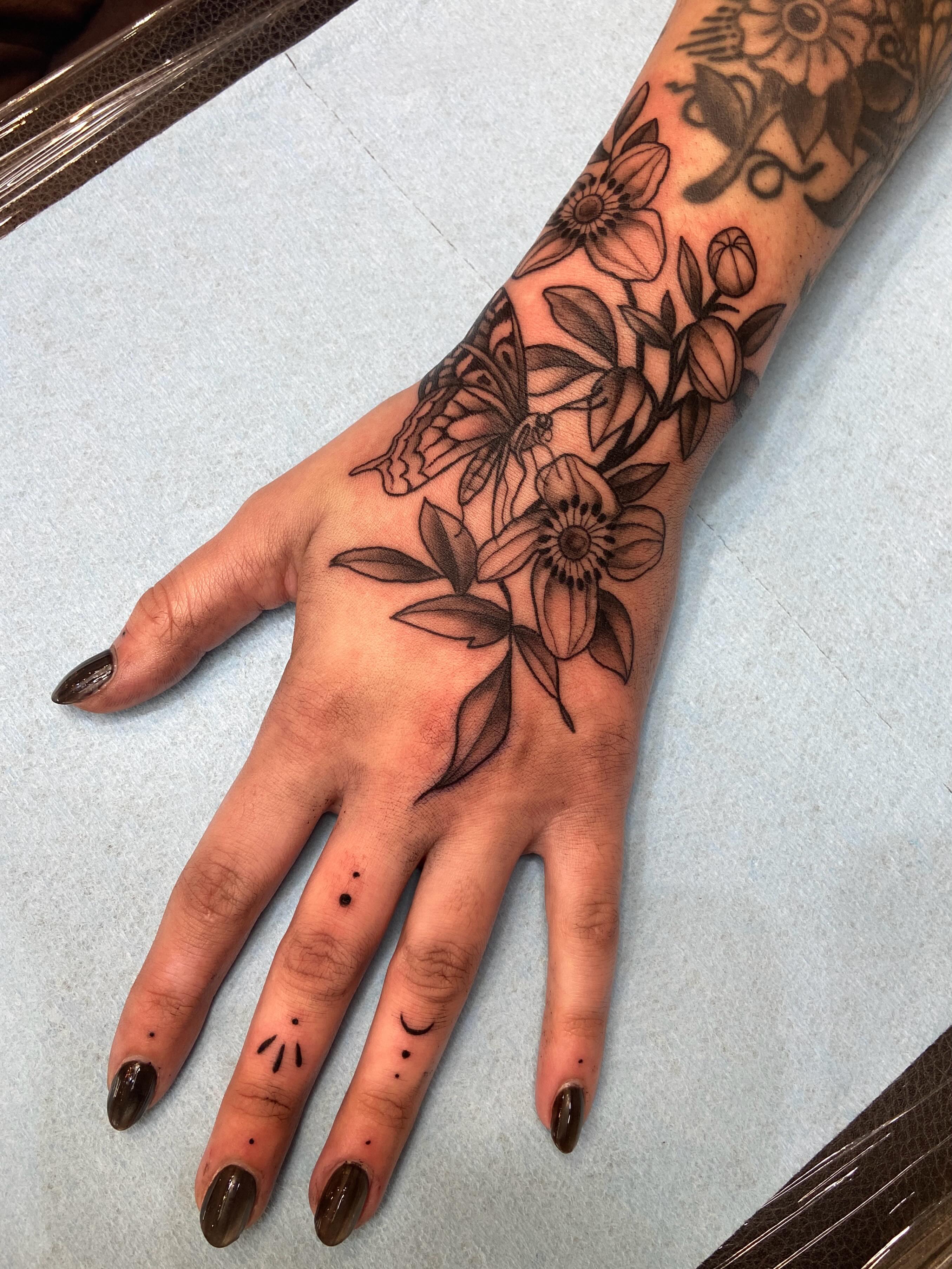 Floral design black and grey tattoo on the hand by Dawn Carr, Richmond, Virginia