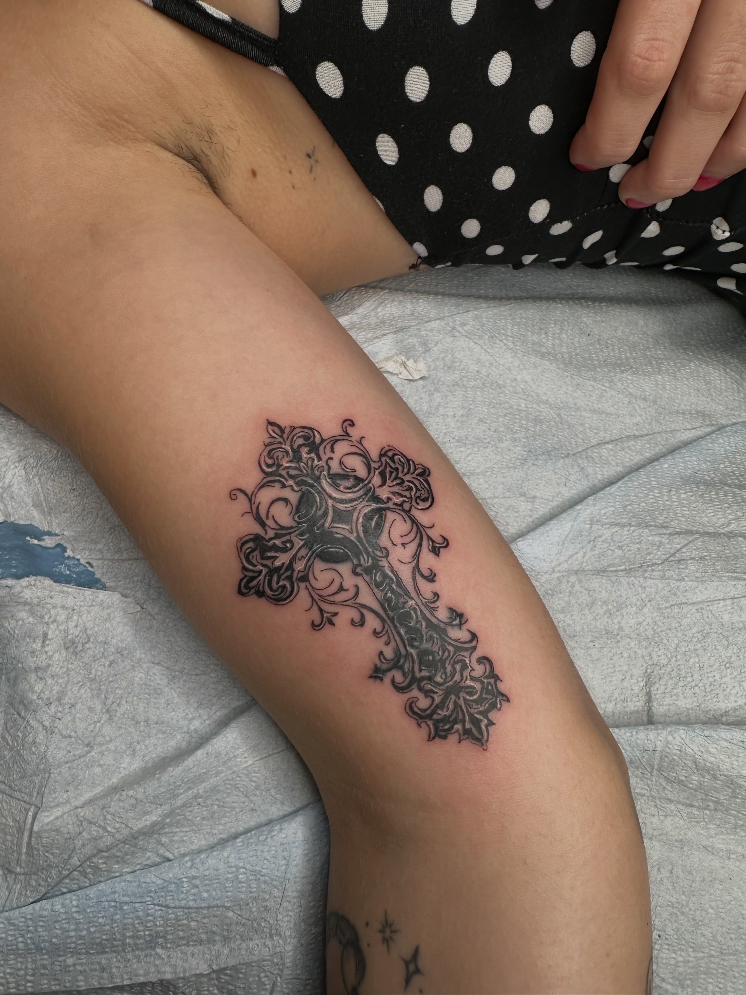 Cross black and grey tattoo on the forearm by Alex Gunshefski