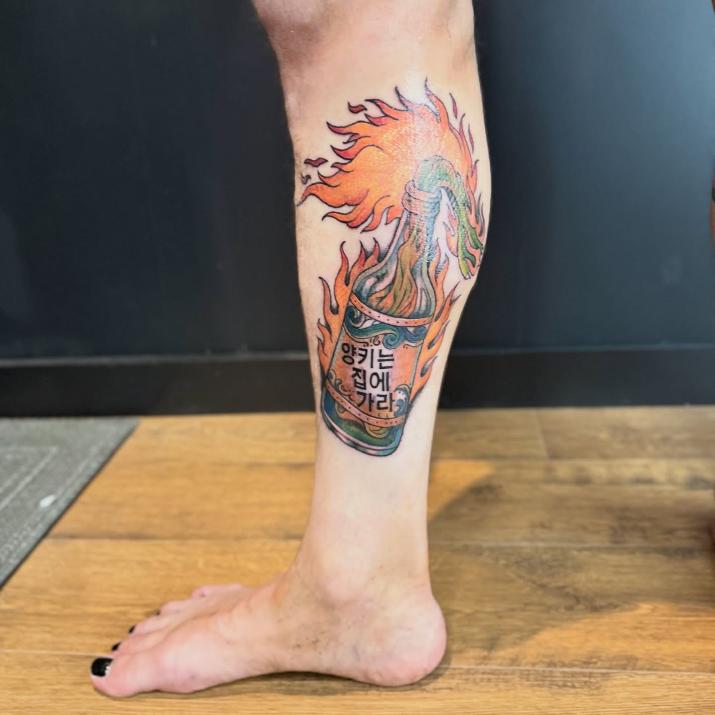 Flaming can American traditional tattoo on the calf by Chuckthegirl