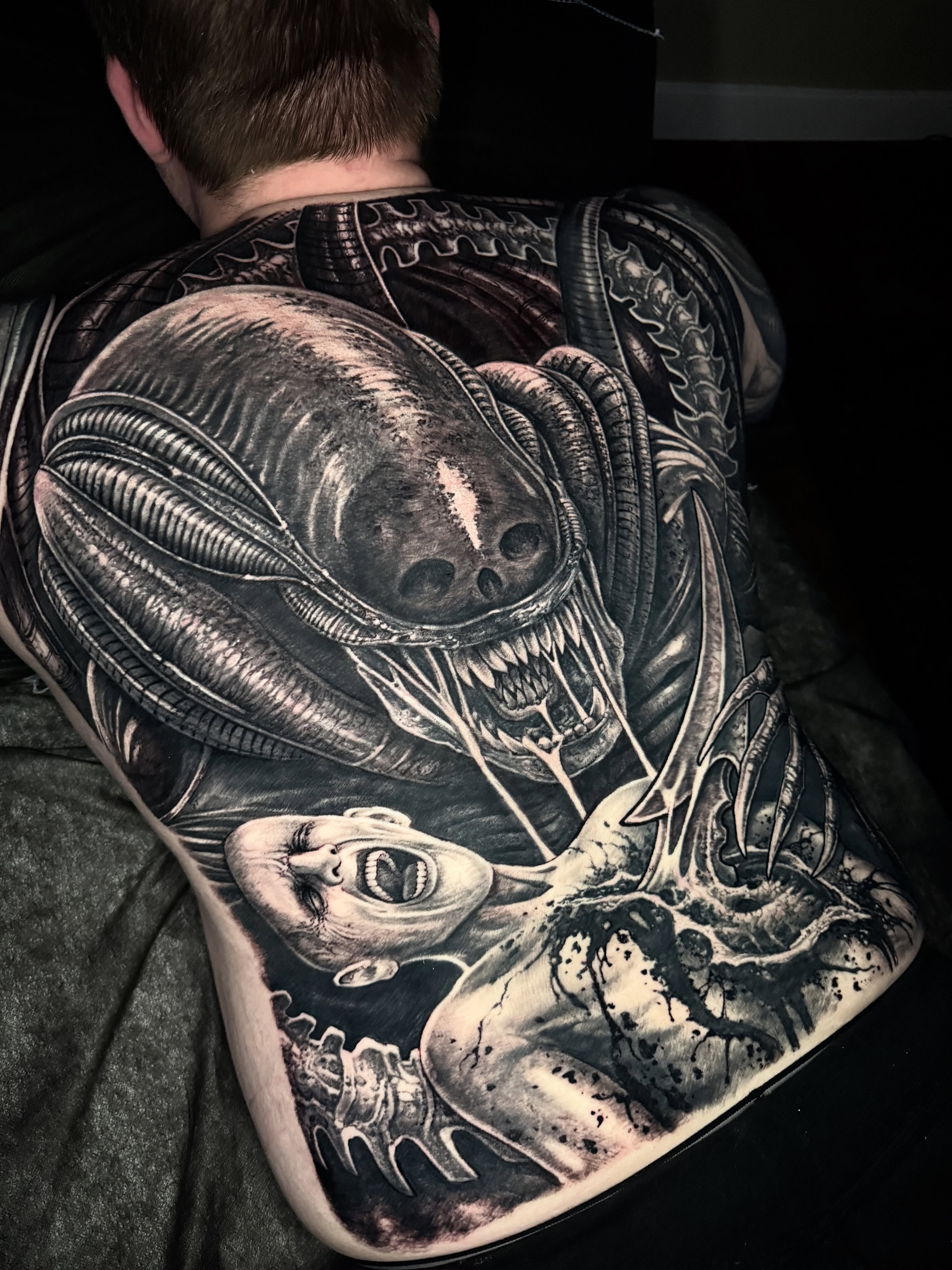 Alien creature realism tattoo on the back by Jeremiah Barba