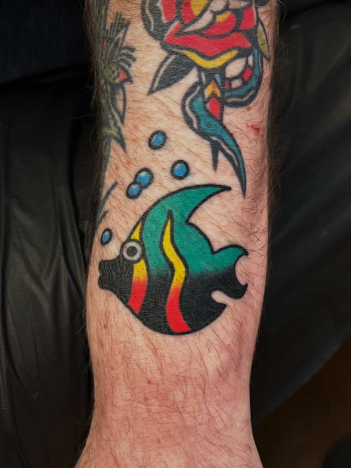 Fish American traditional tattoo on the forearm by Traditional Tattooing
