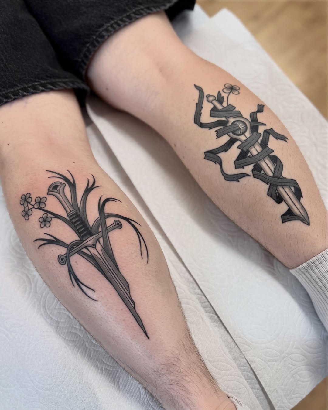 Swords and flowers realism tattoo on the forearm by Nia (Knee-uhh) 🦷