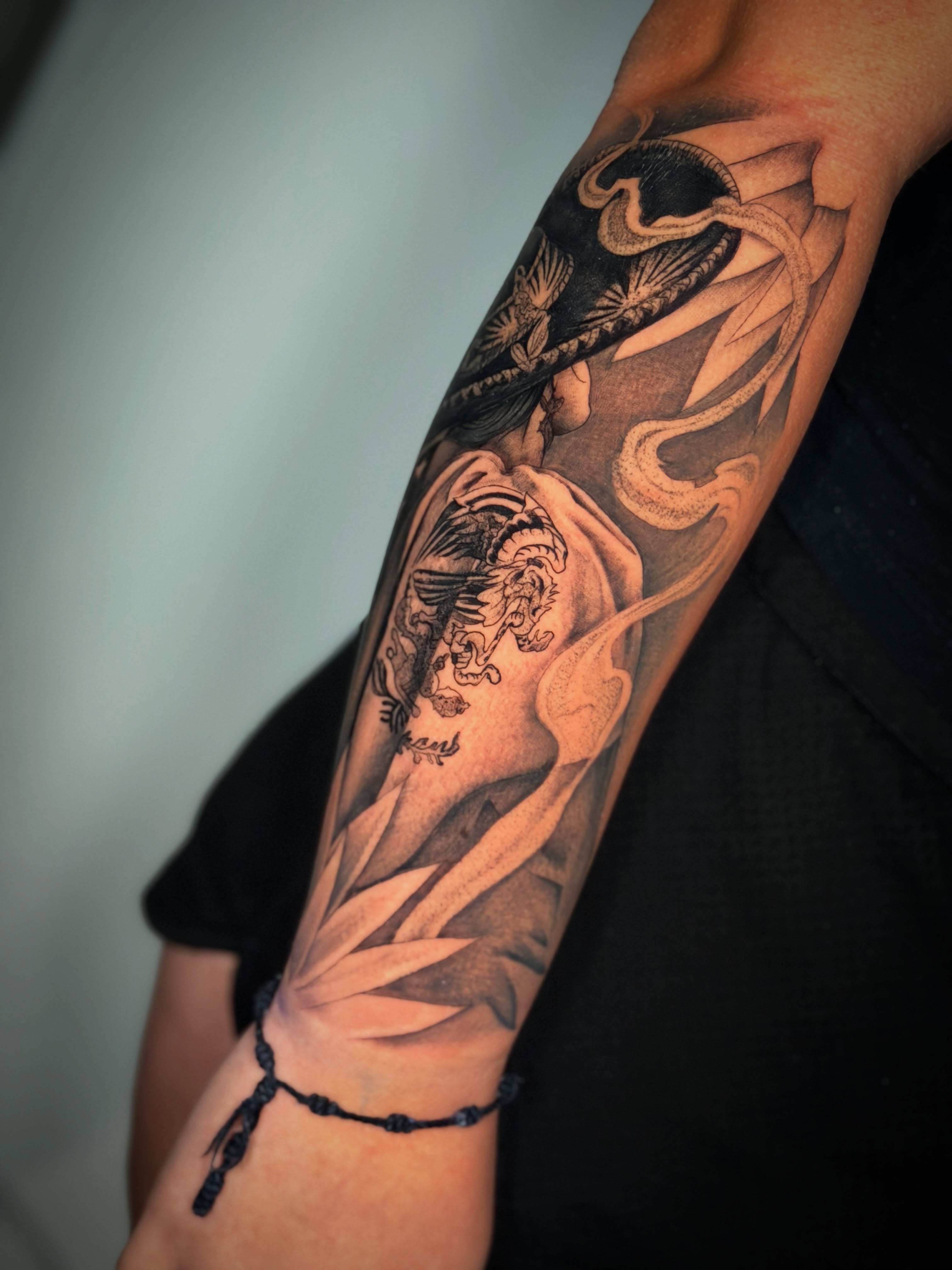 Tiger and dragon realism tattoo on the forearm by Las Vegas Tattoo Artist