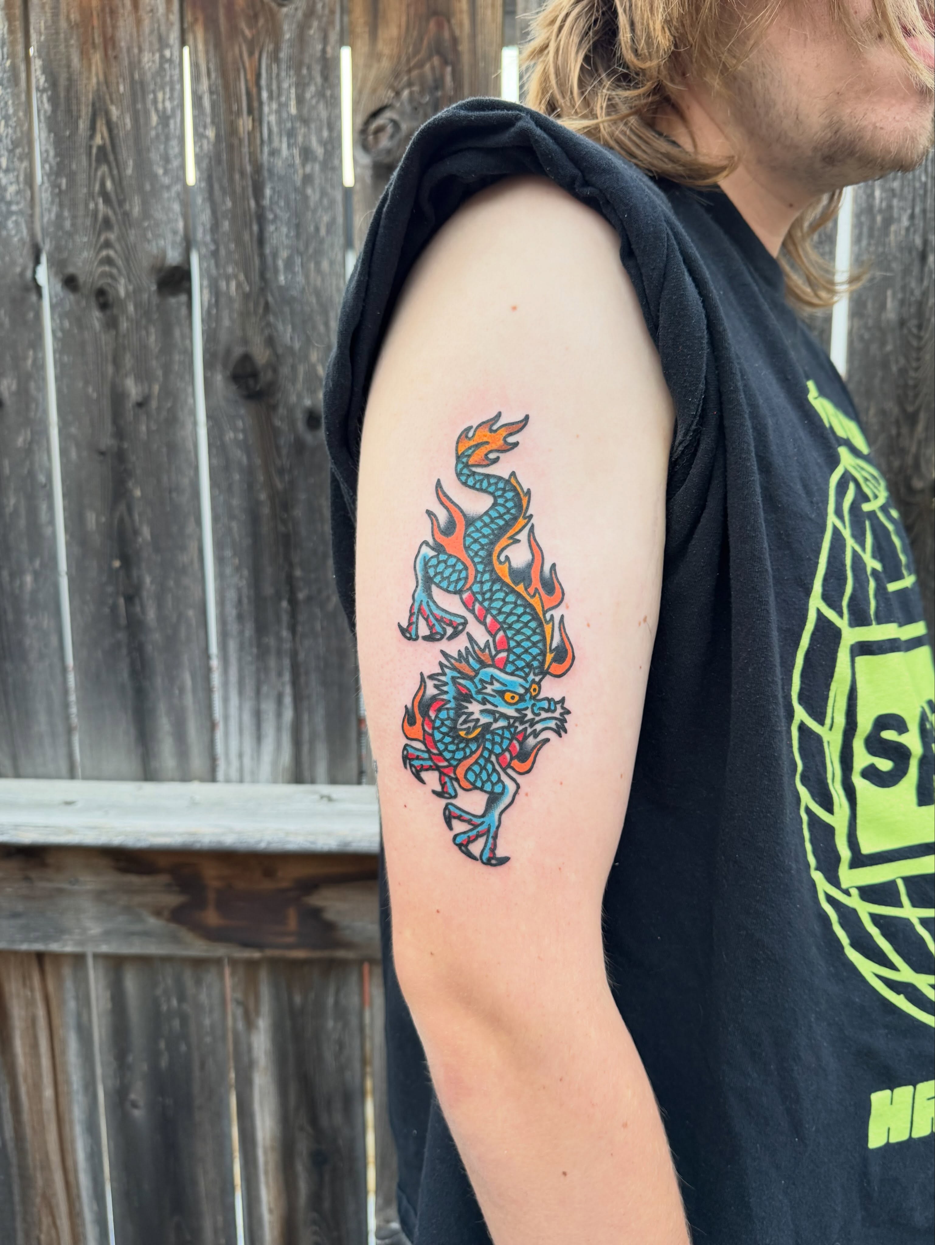 Flame dragon new school tattoo on the forearm by Oldschool Tattooer