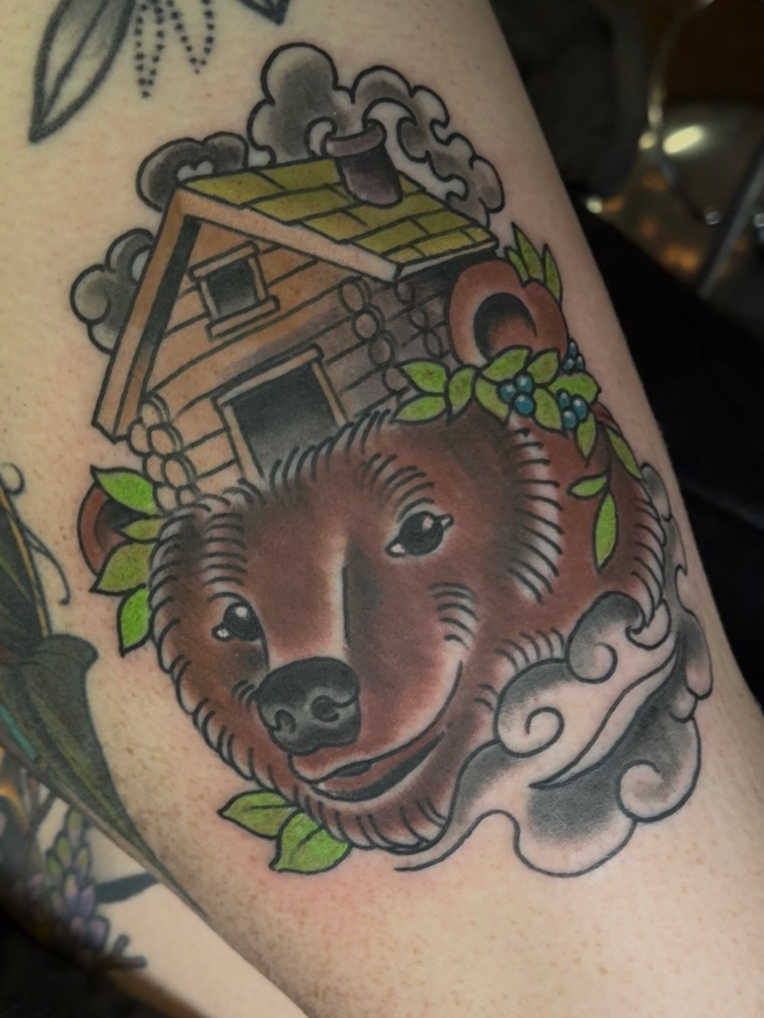 Bear and cabin American traditional tattoo on the forearm by Sean Wilcox, Des Moines, Iowa