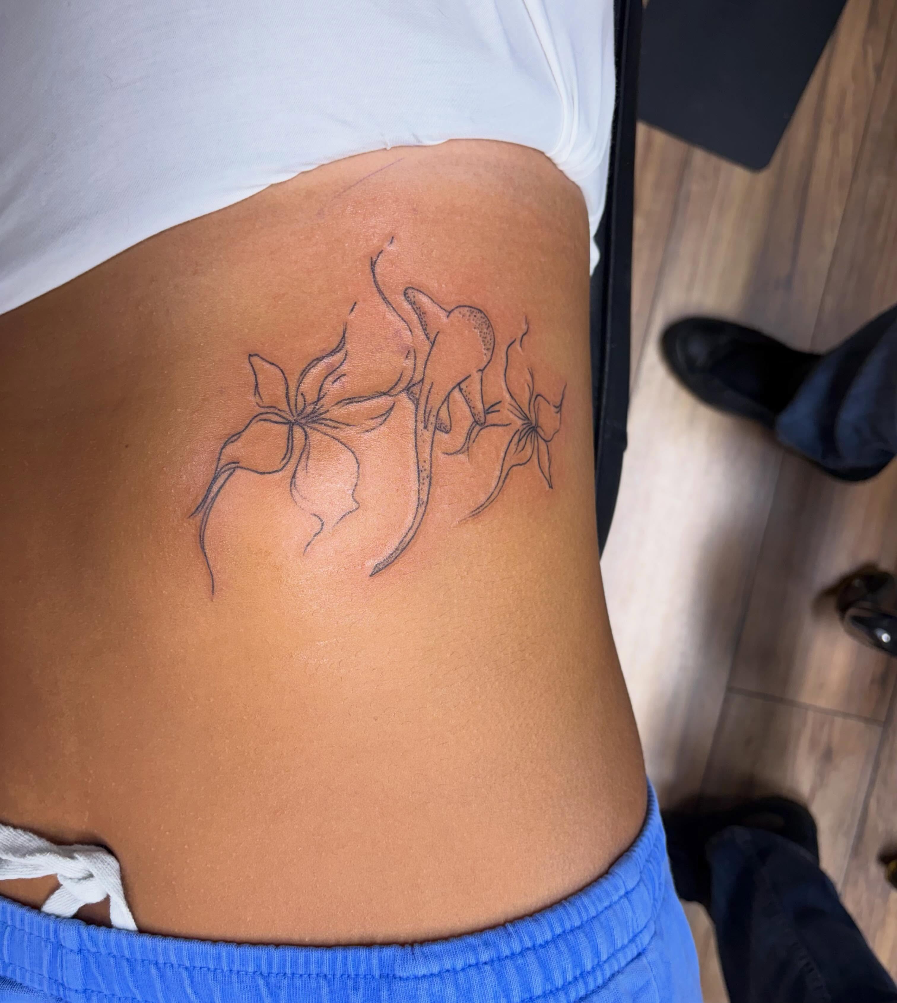 Flowers black and grey tattoo on the ribs by Justin Evans kc ink