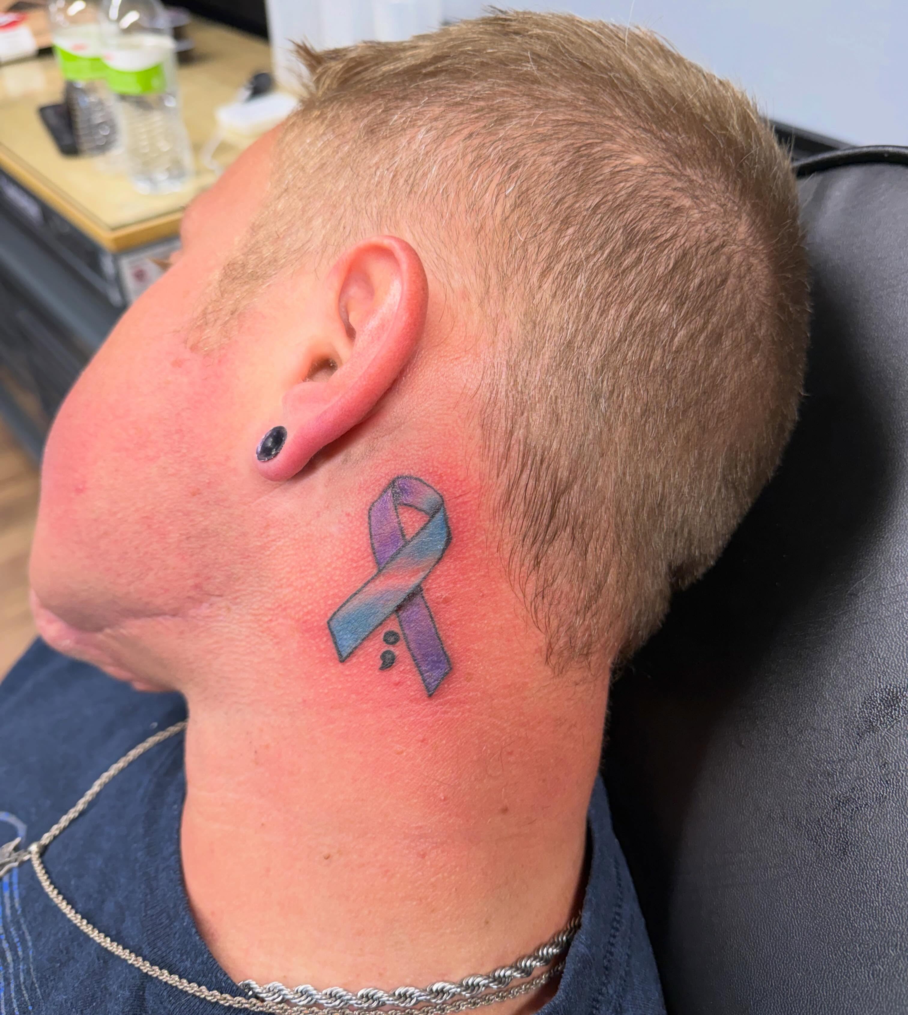 Ribbon dotwork tattoo on the neck by Justin Evans kc ink
