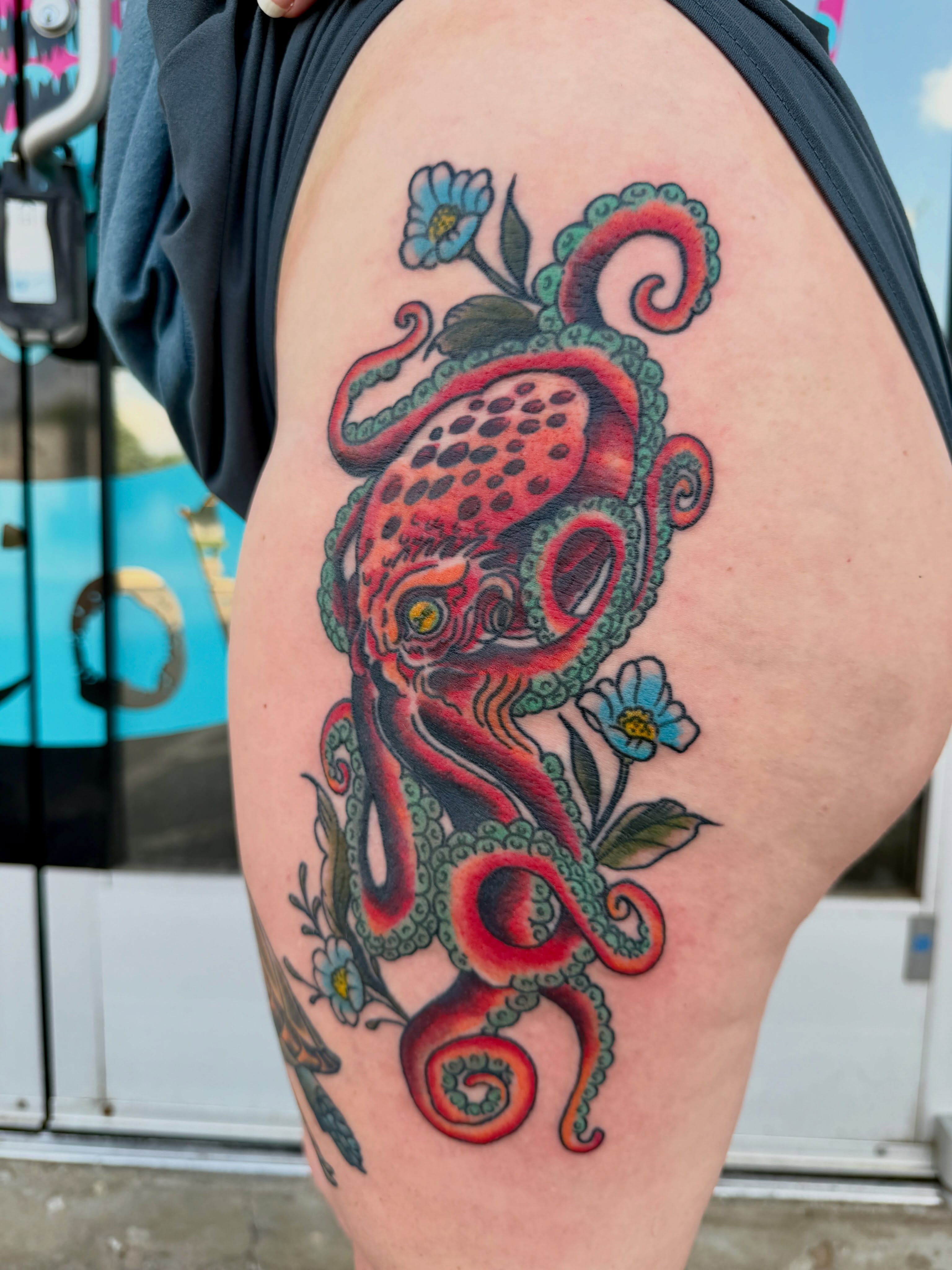 Octopus American traditional tattoo on the thigh by Ali Calis
