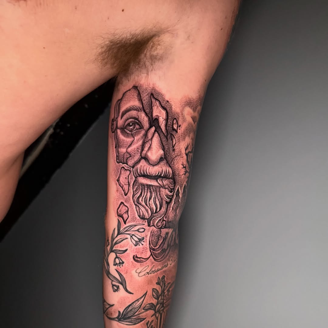 Ancient man realism tattoo on the forearm by Alex Wheelock