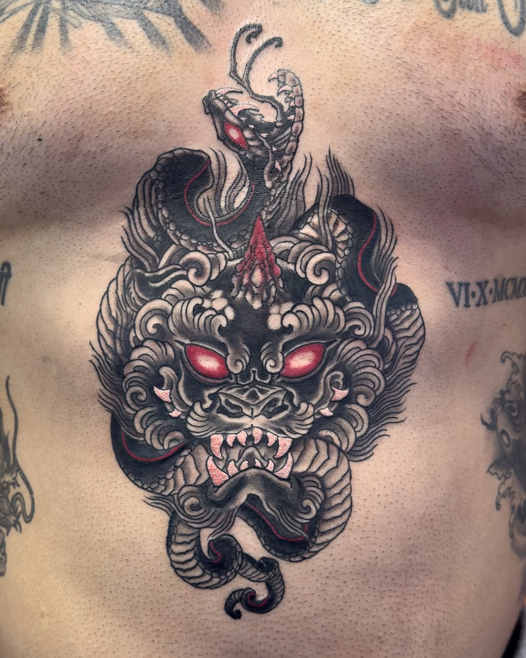 Lion japanese irezumi tattoo on the chest by James Bird, Vancouver, British Columbia