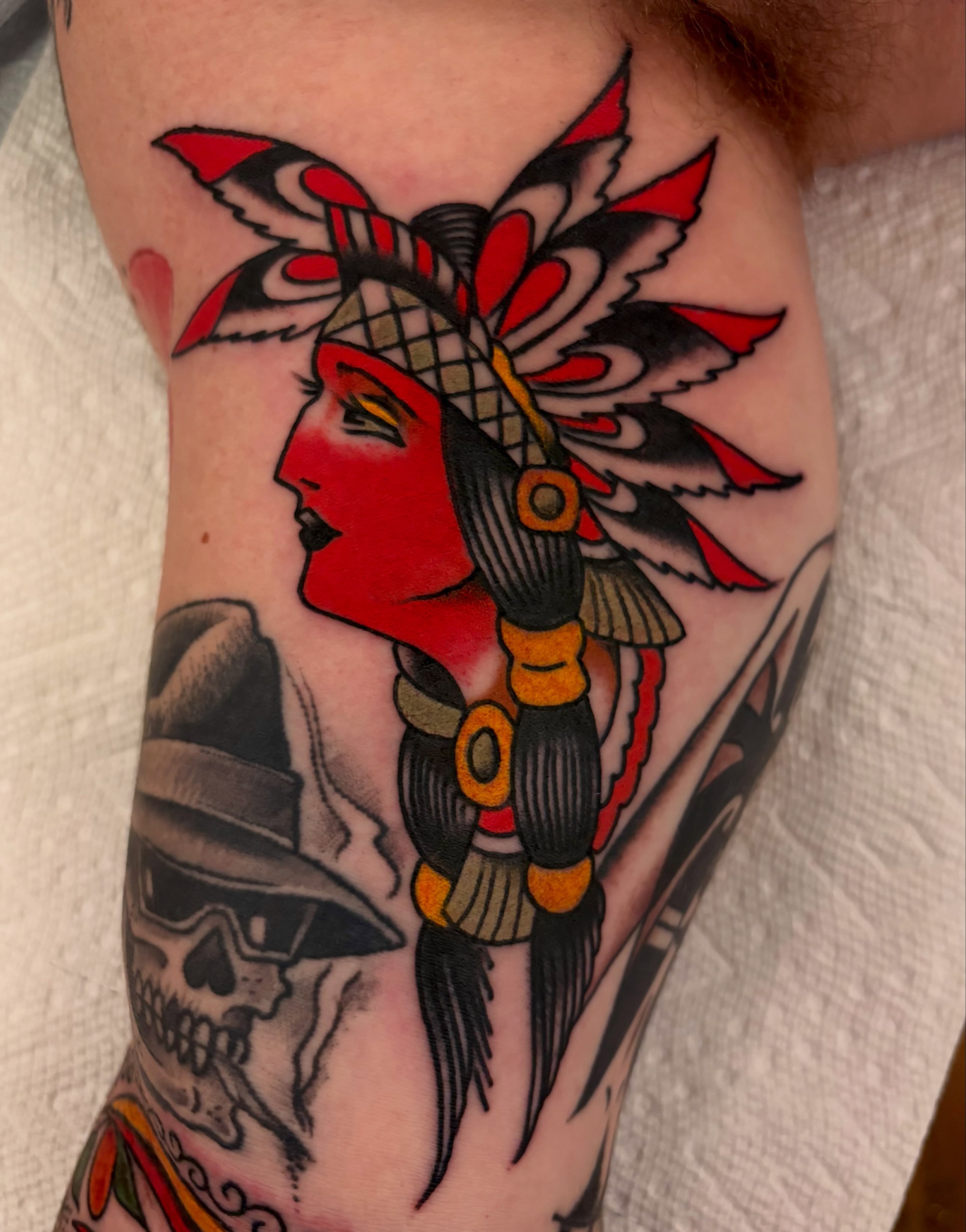 Indian headdress American traditional tattoo on the forearm by Shane Coslett