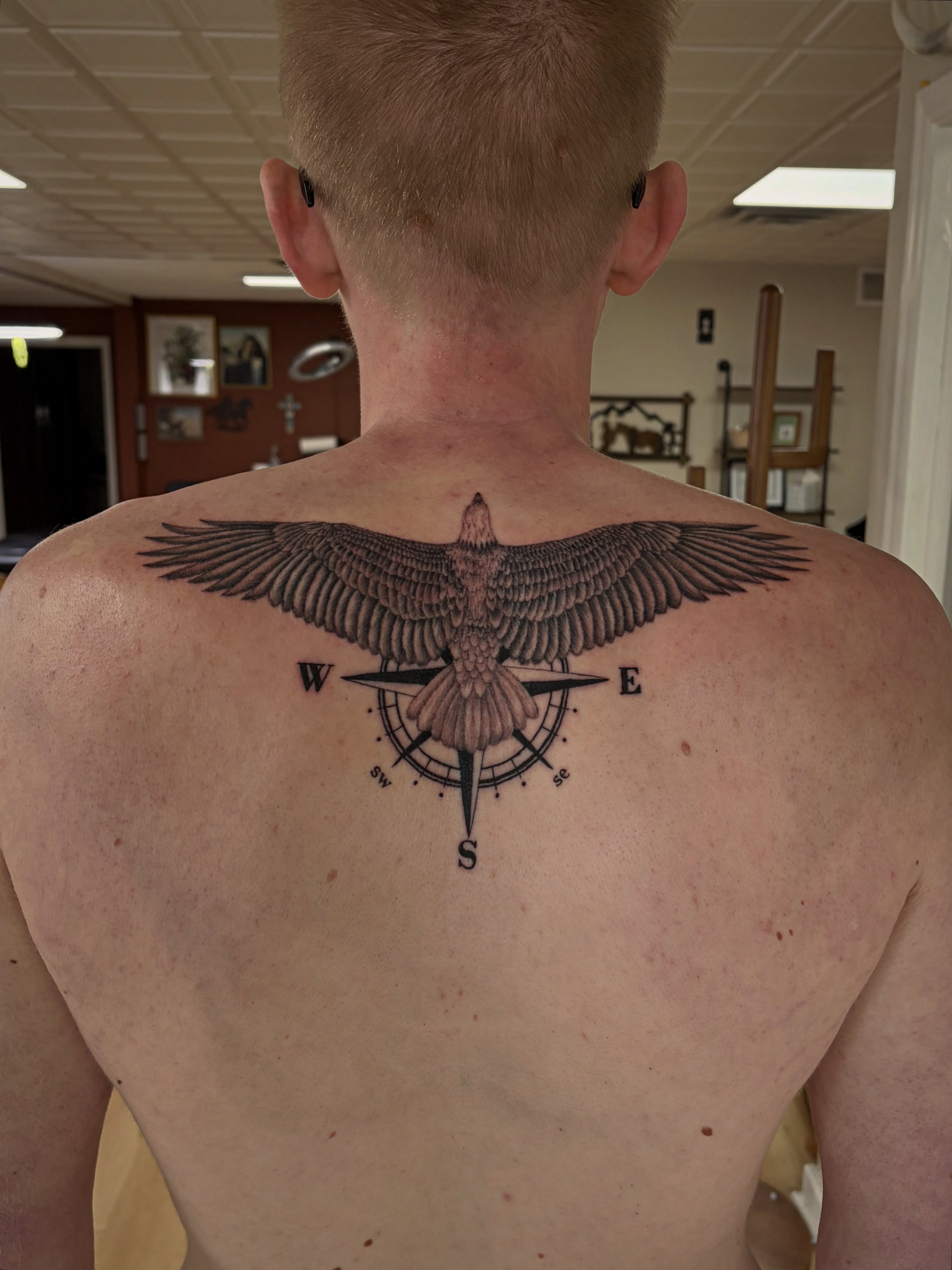 Eagle and compass black and grey tattoo on the back by Francesca Siwa