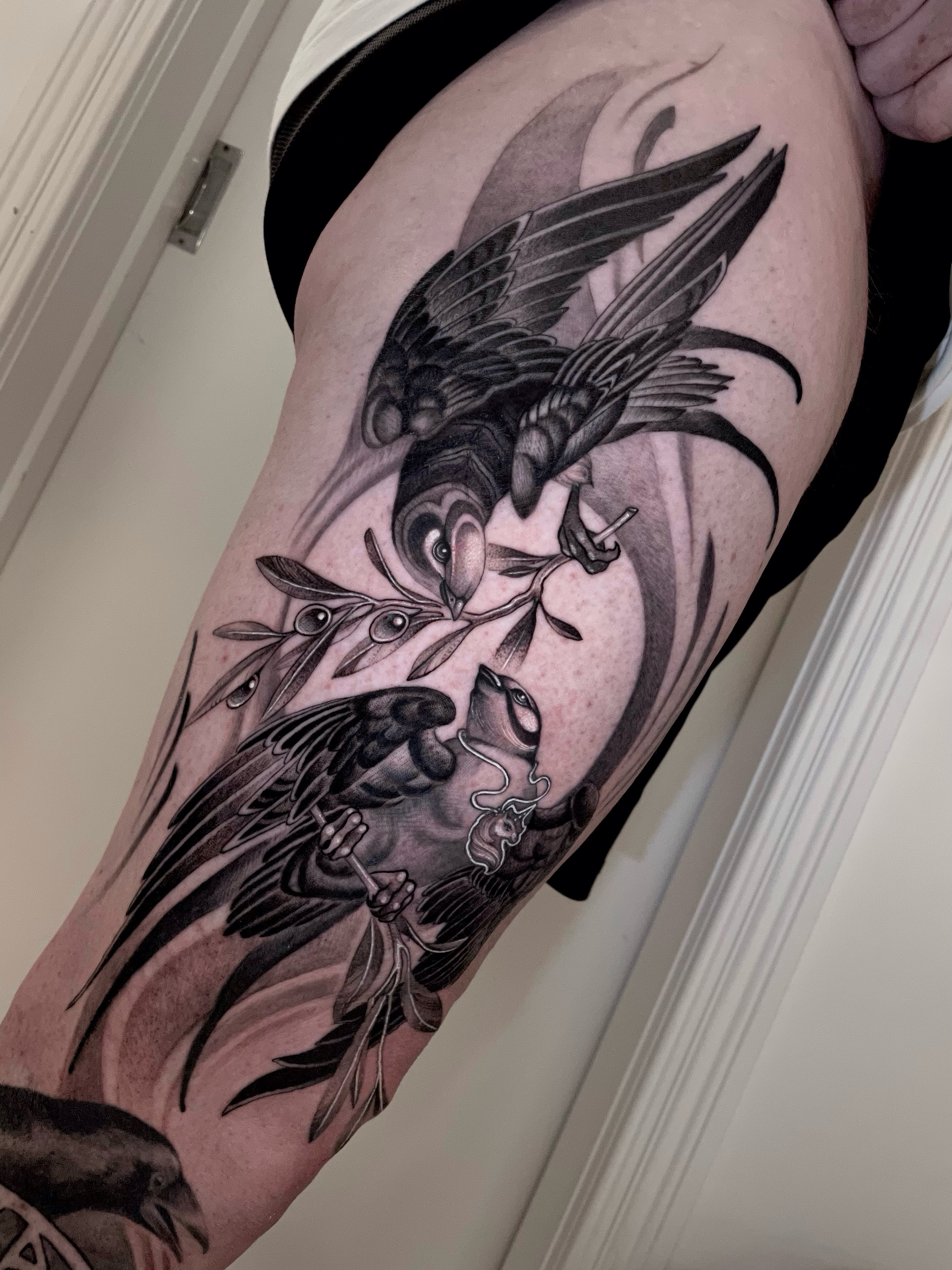 Birds and branch realism tattoo on the thigh by Michelle Carlton