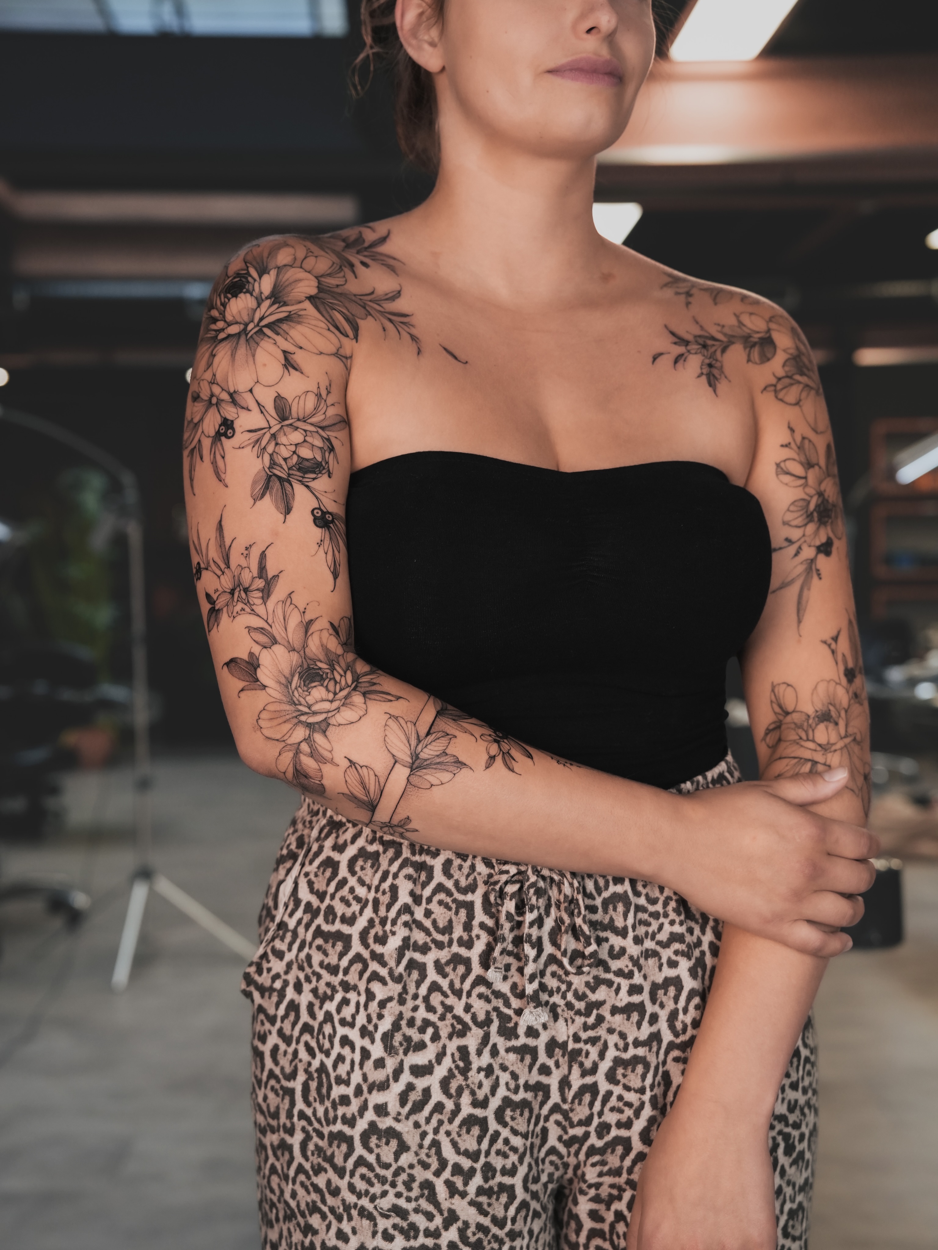 Floral black and grey tattoo on the upper arm by Yuliia Babych tattoo AUSTIN