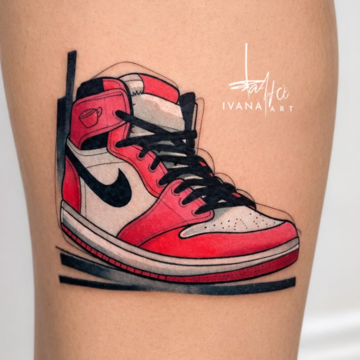 Red and white sneaker American traditional tattoo on the leg by Ivana Belakova