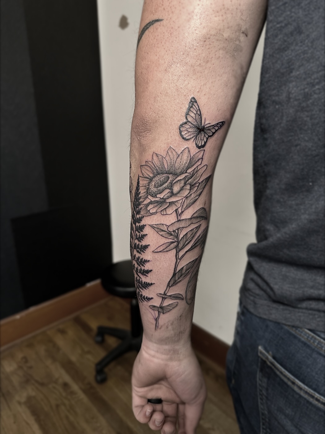 Sunflower and butterfly black and grey tattoo on the forearm by Rafael Alfredo Armas Hoyos, Salt Lake City, Utah