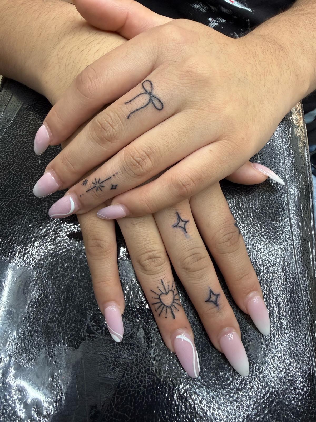 Stars and sun dotwork tattoo on the hand by Kraken ink Tattoo, San Francisco, California