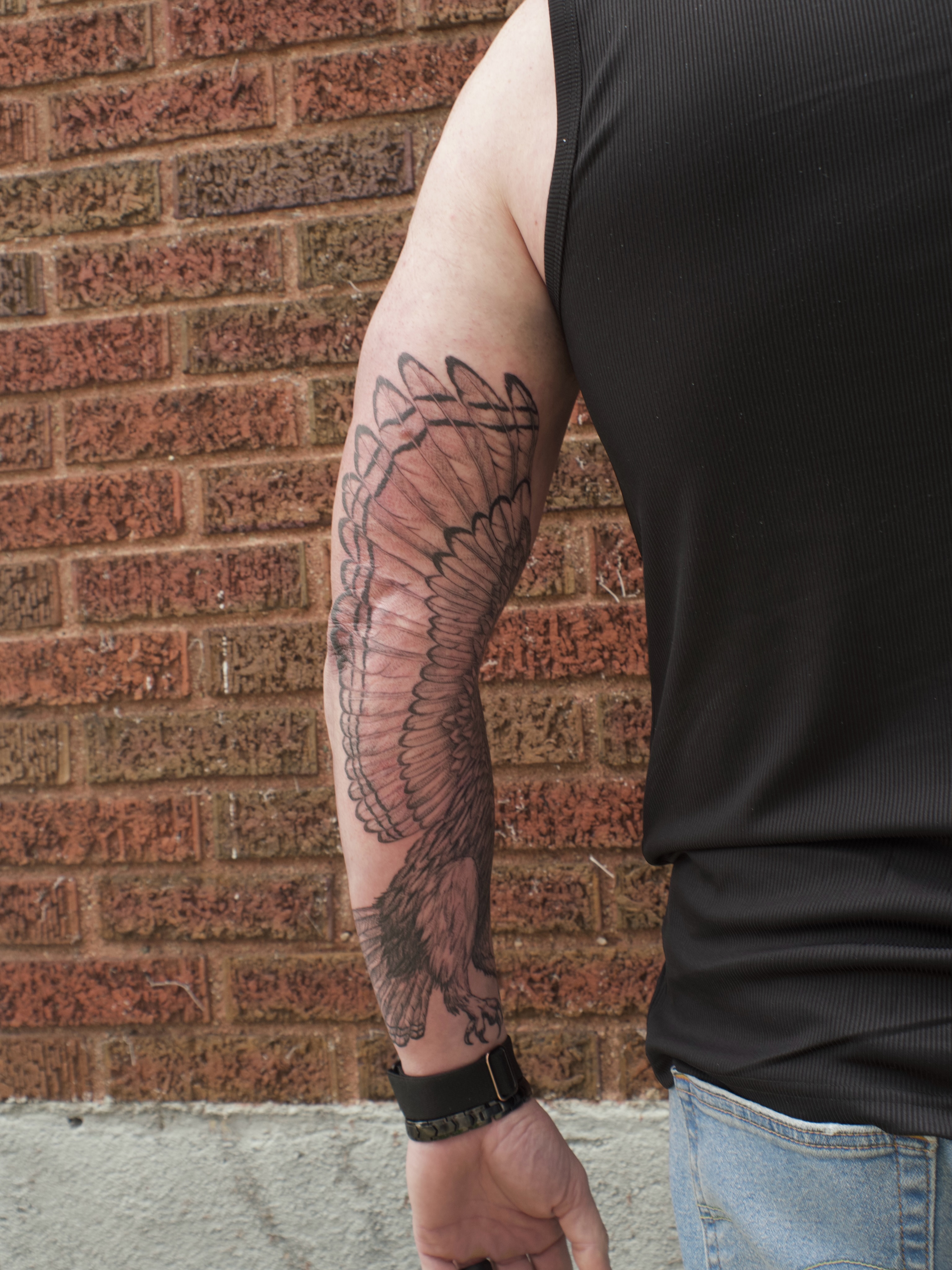 Winged bird black and grey tattoo on the forearm by Kevin Rotramel, Dayton, Ohio