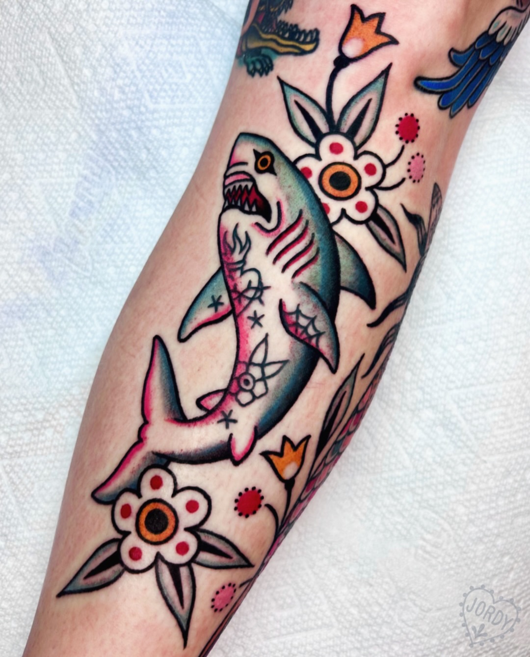 Shark and flowers American traditional tattoo on the forearm by jordy, Philadelphia, Pennsylvania