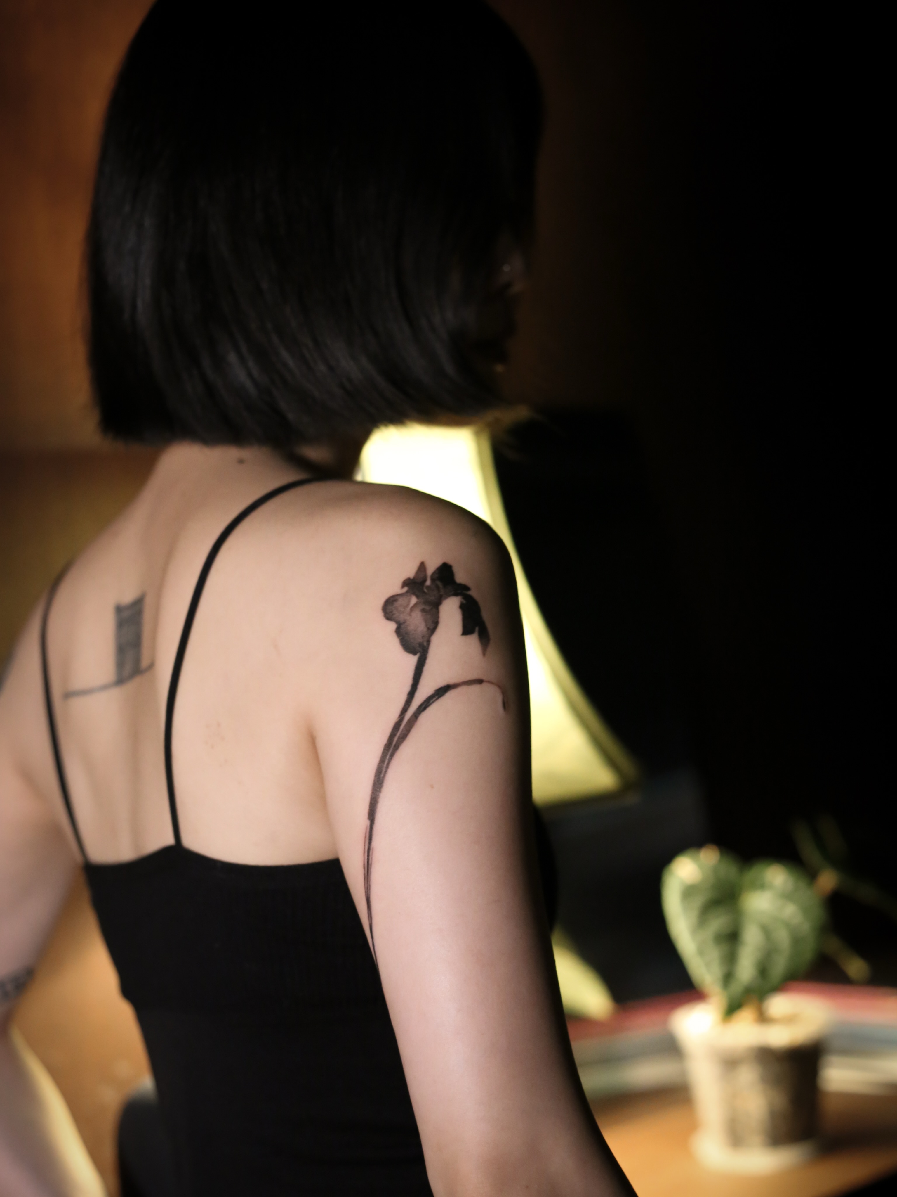 Iris black and grey tattoo on the shoulder by Blight