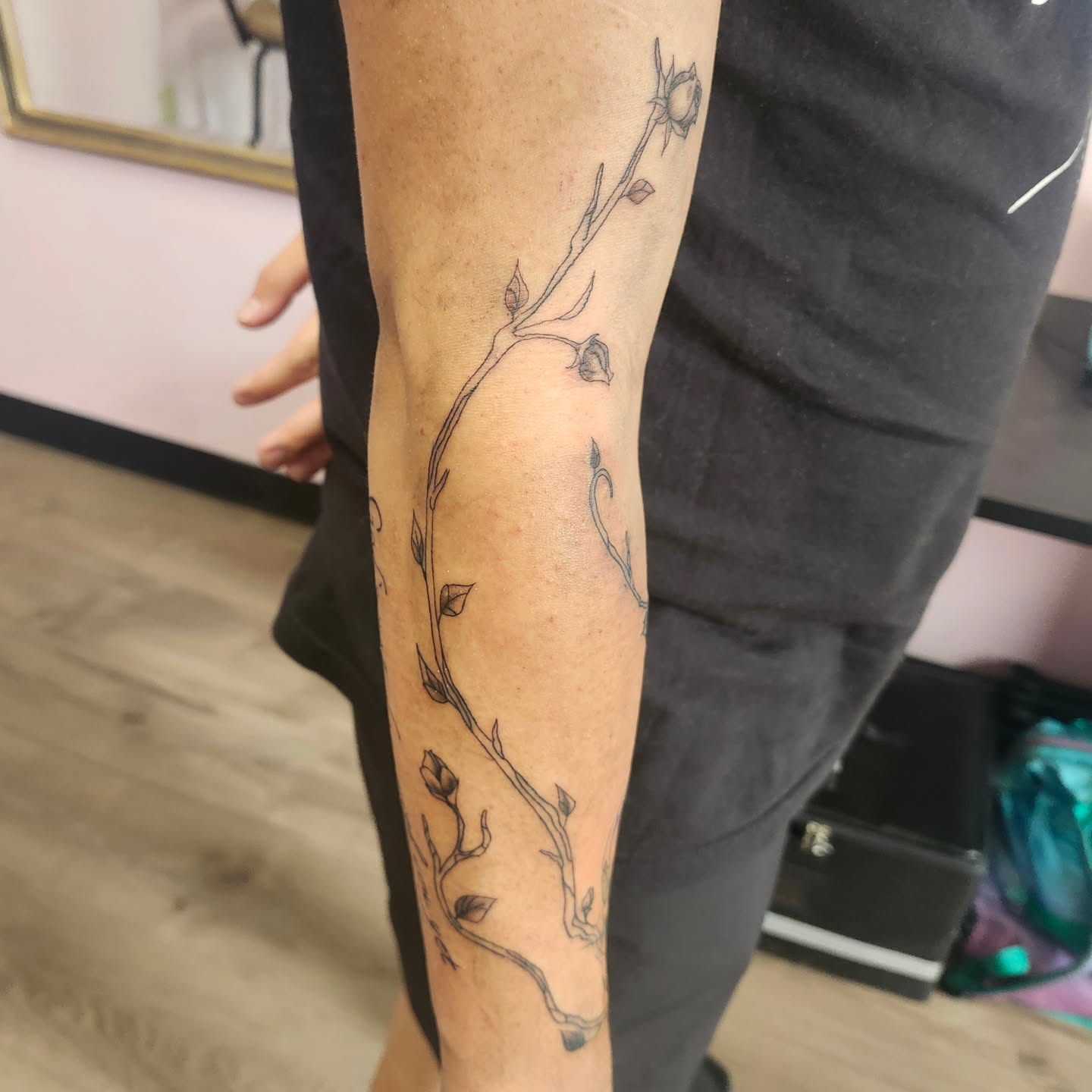Branch with flowers black and grey tattoo on the forearm by Meredith 🎈 Tattoo the Bride ✝️