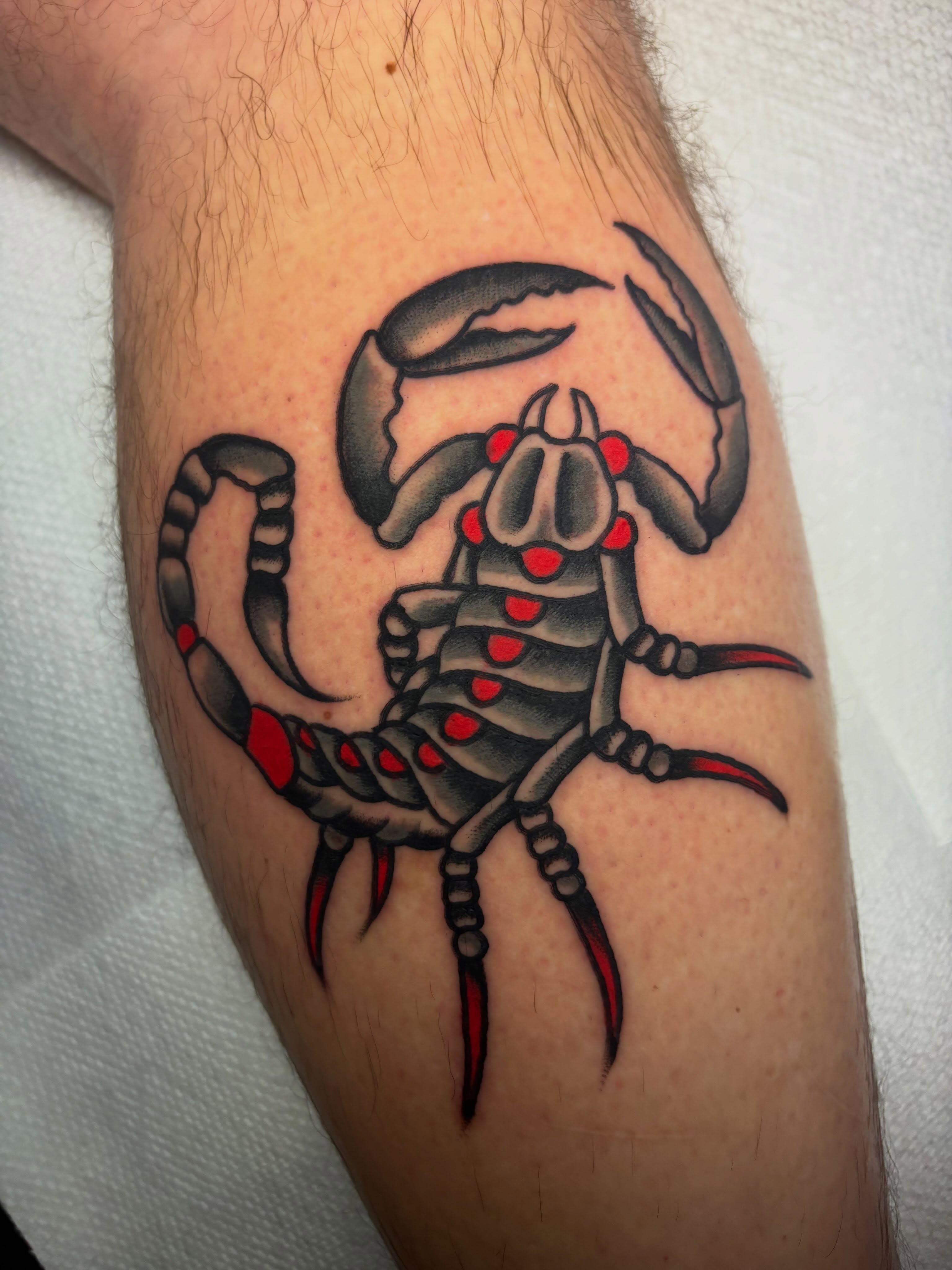 Scorpion American traditional tattoo on the forearm by Chris Dufresne