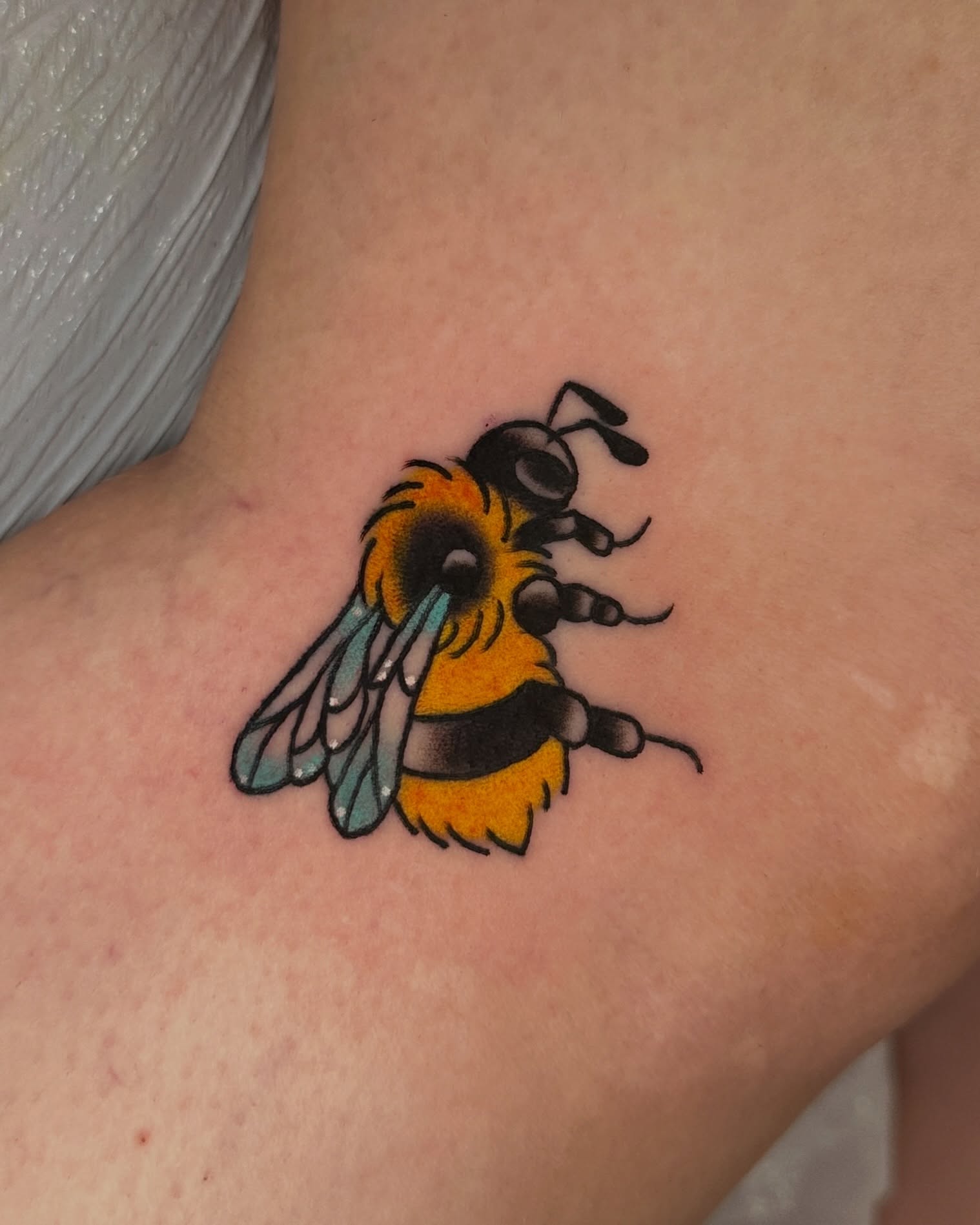 Bee new school tattoo on the forearm by Paige Ochoa
