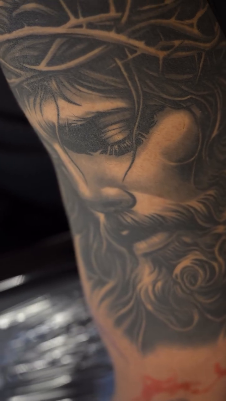 Jesus Christ portrait realism tattoo by Lukasz Olszanski
