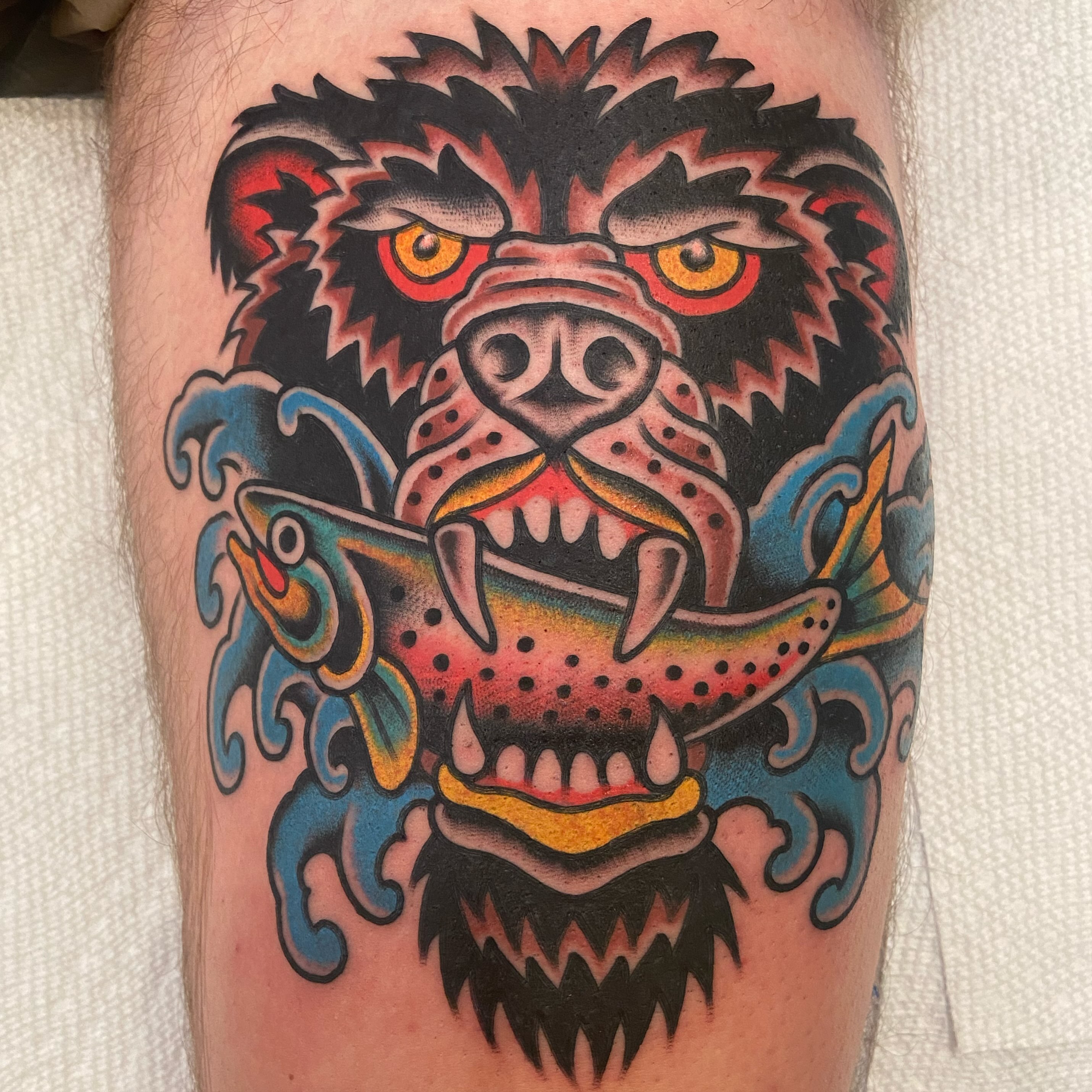 Bear and fish American traditional tattoo on the forearm by Anthony Jaeger, Seattle, Washington