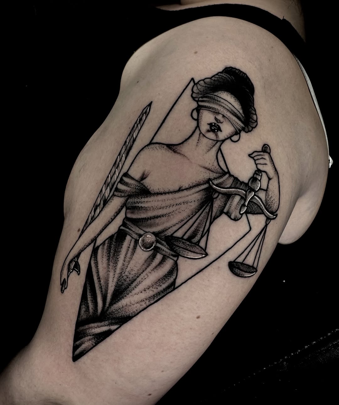 Lady Justice black and grey tattoo on the thigh by Brett Brown