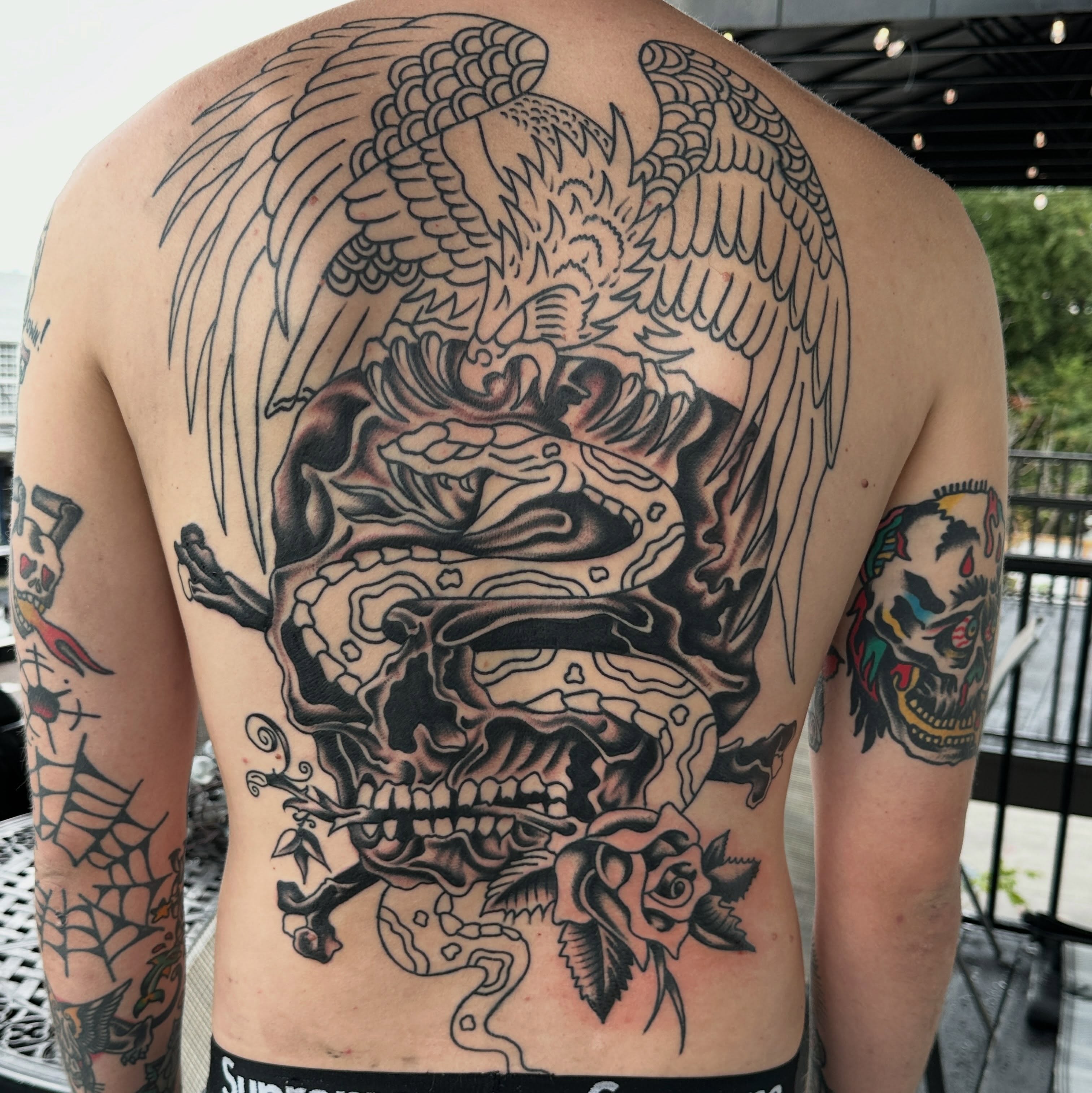 Skull with wings realism tattoo on the back by Jared Allen, Saint Petersburg, Florida