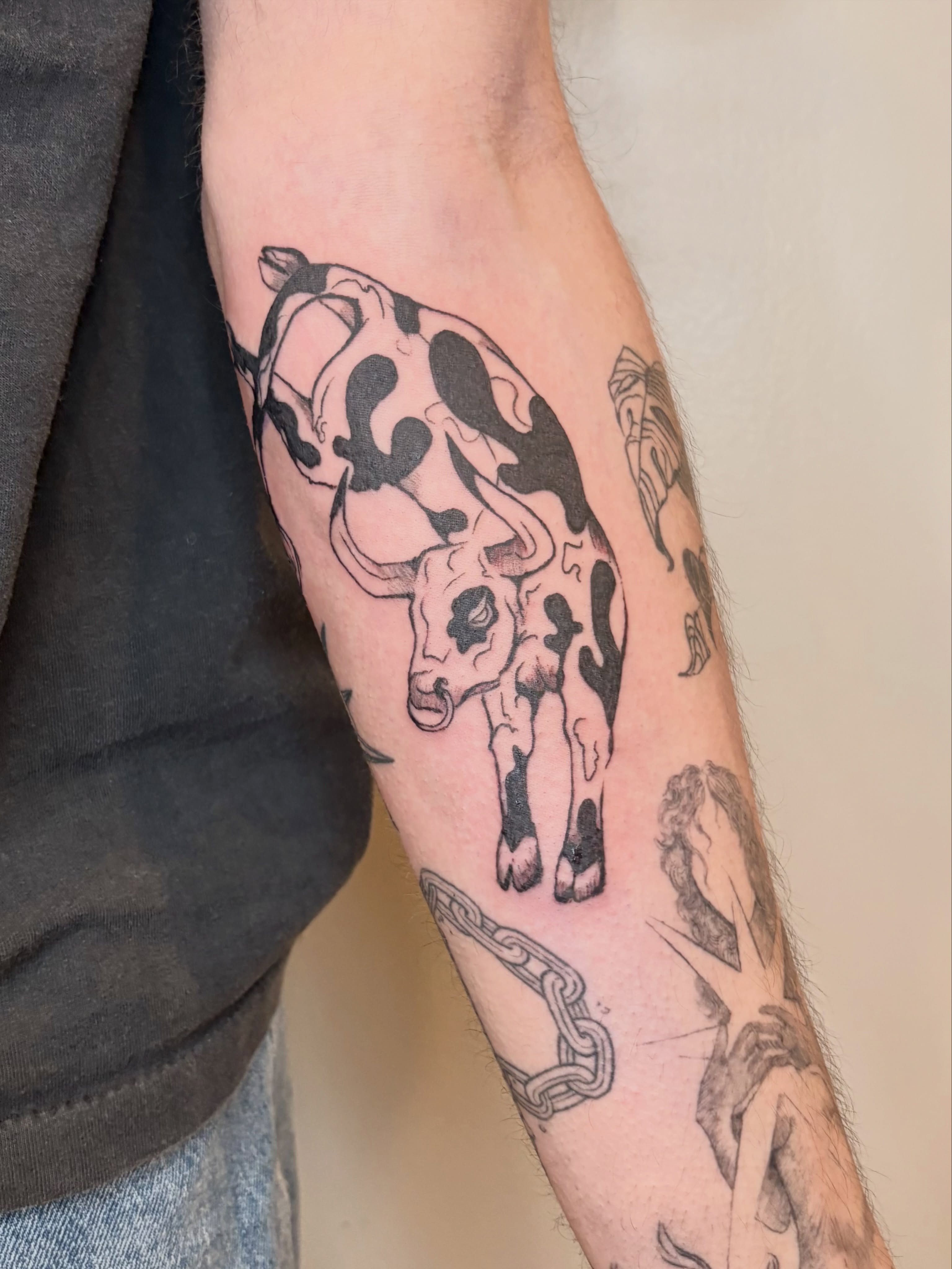 Bull black and grey tattoo on the forearm by Sarah