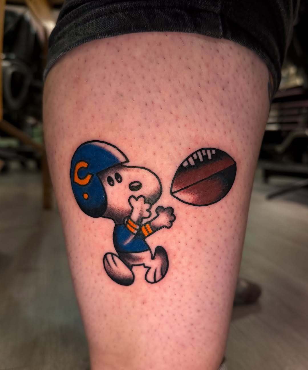 Football player dotwork tattoo on the thigh by Louie Flores