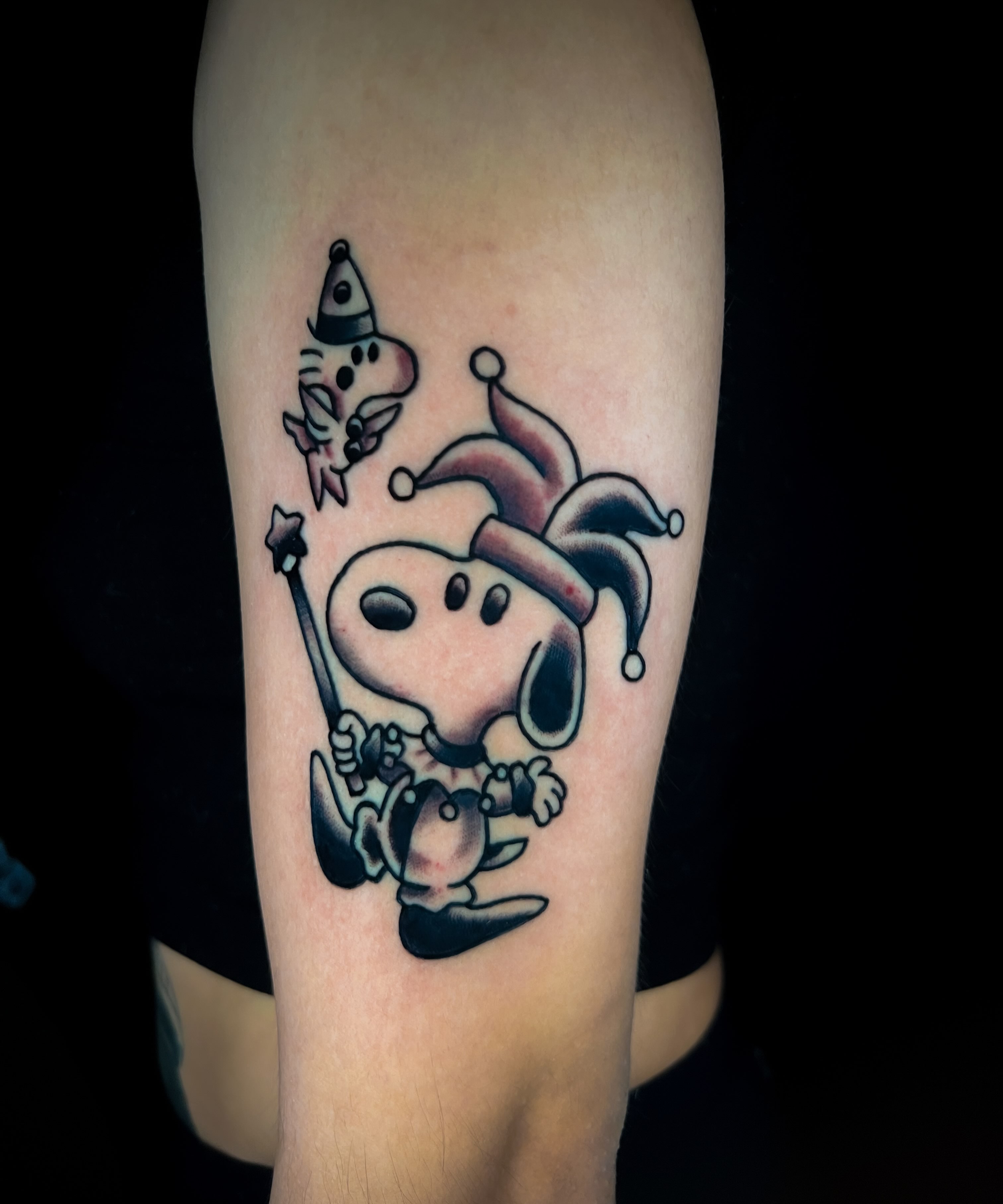 Snoopy American traditional tattoo on the forearm by Louie Flores